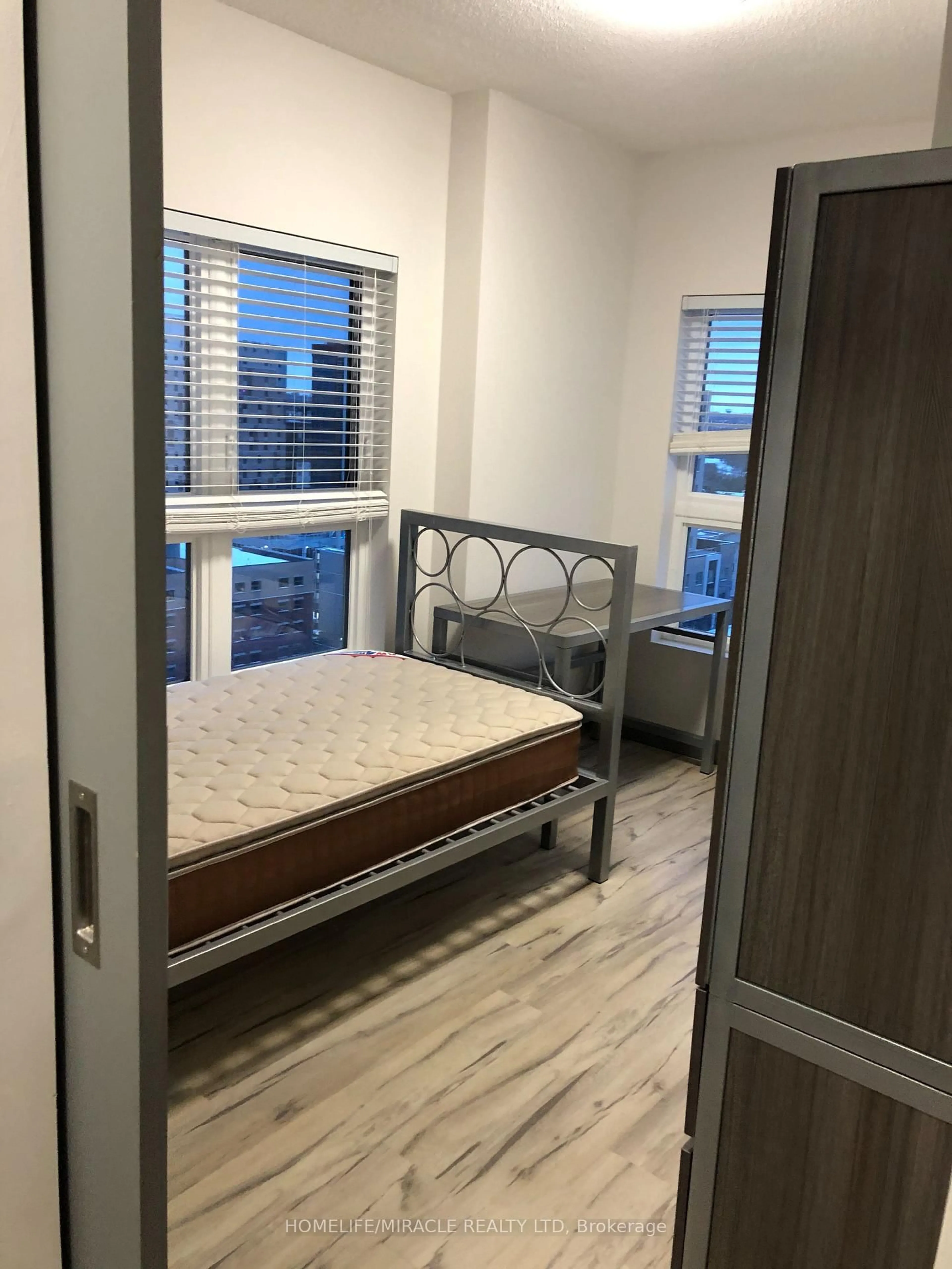Bedroom with bed, wood/laminate floor for 258B Sunview St #2126, Waterloo Ontario N2L 0H7