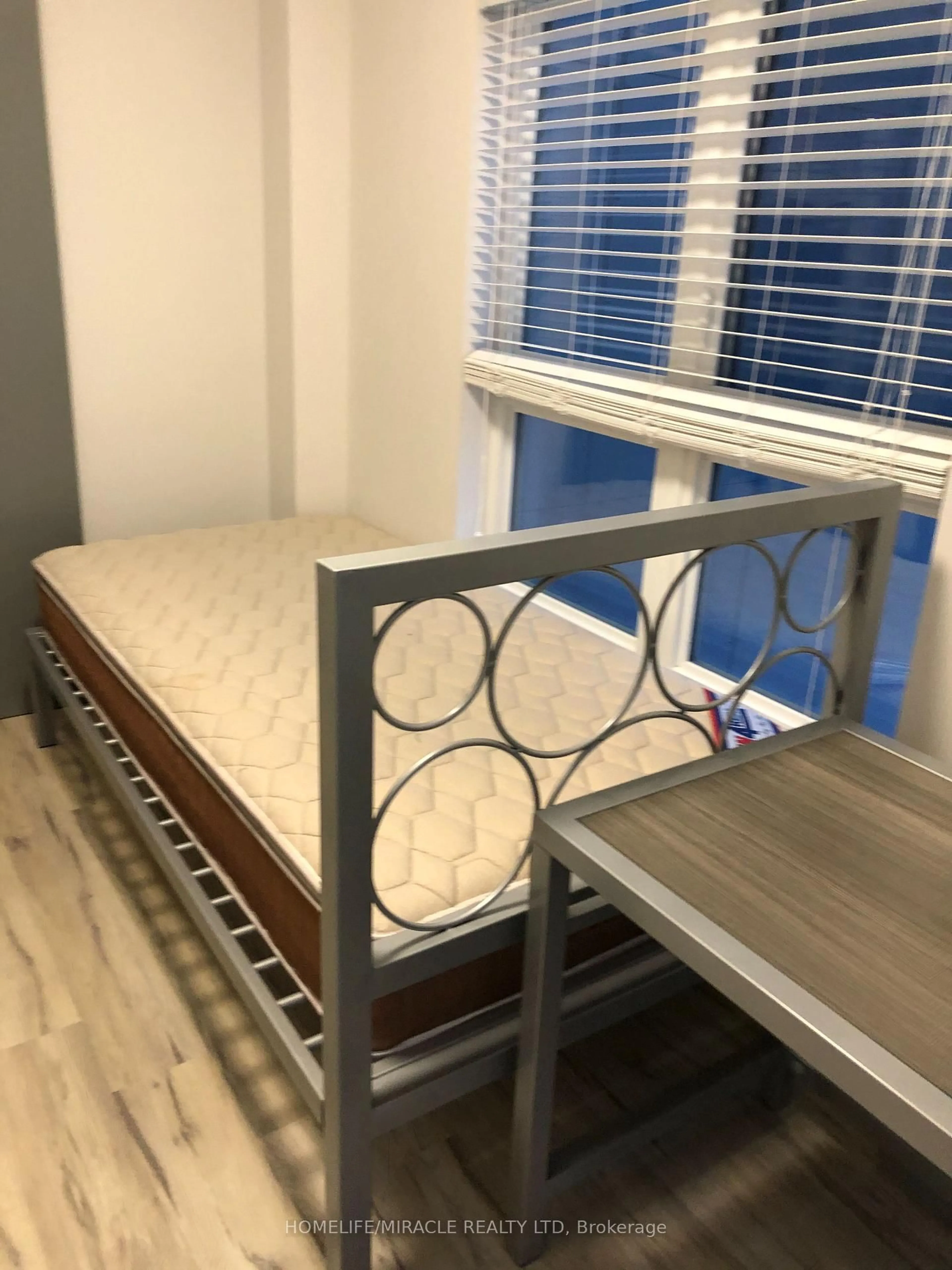 Bedroom with bed, wood/laminate floor for 258B Sunview St #2126, Waterloo Ontario N2L 0H7