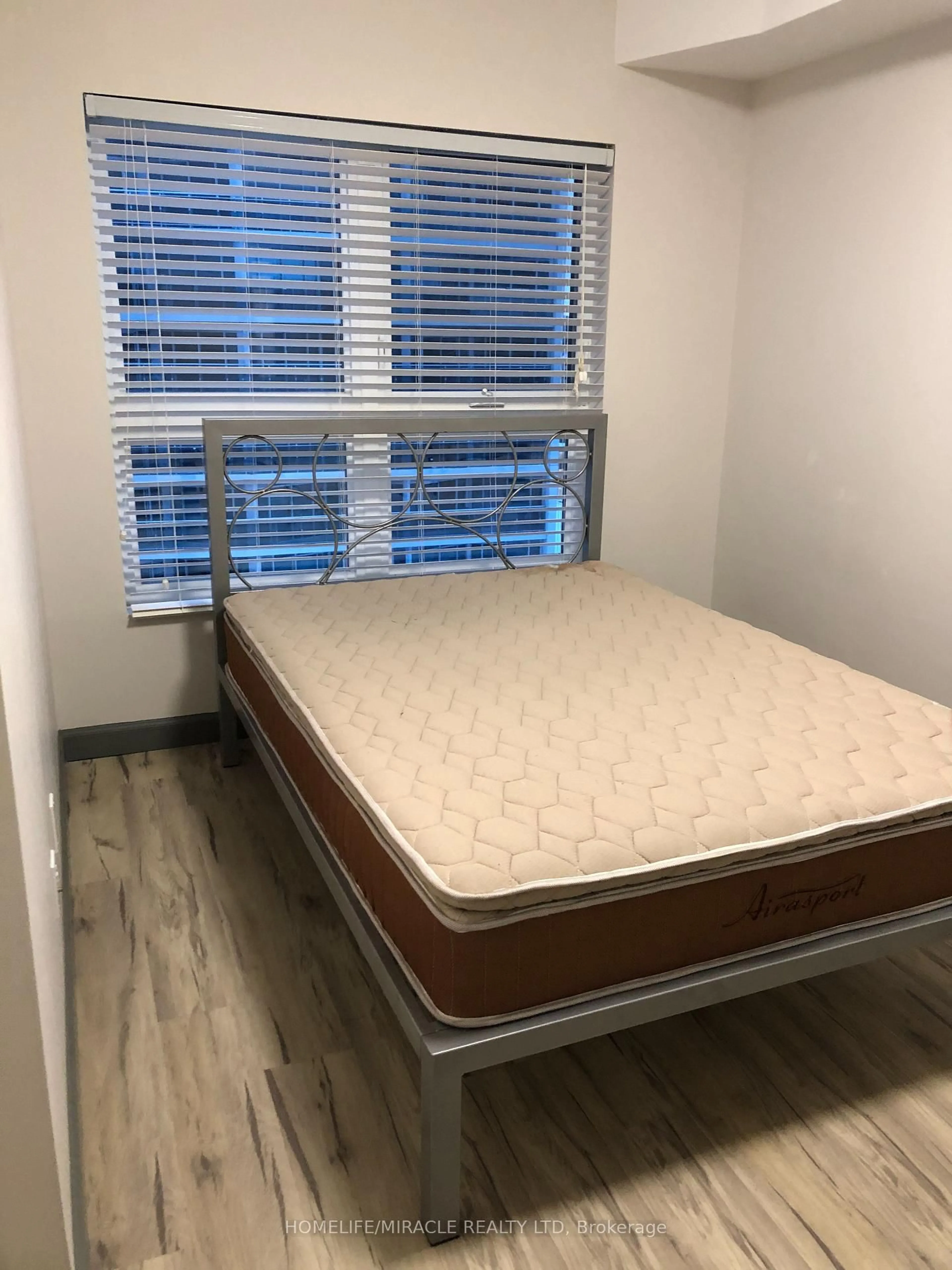 Bedroom with bed, wood/laminate floor for 258B Sunview St #2126, Waterloo Ontario N2L 0H7
