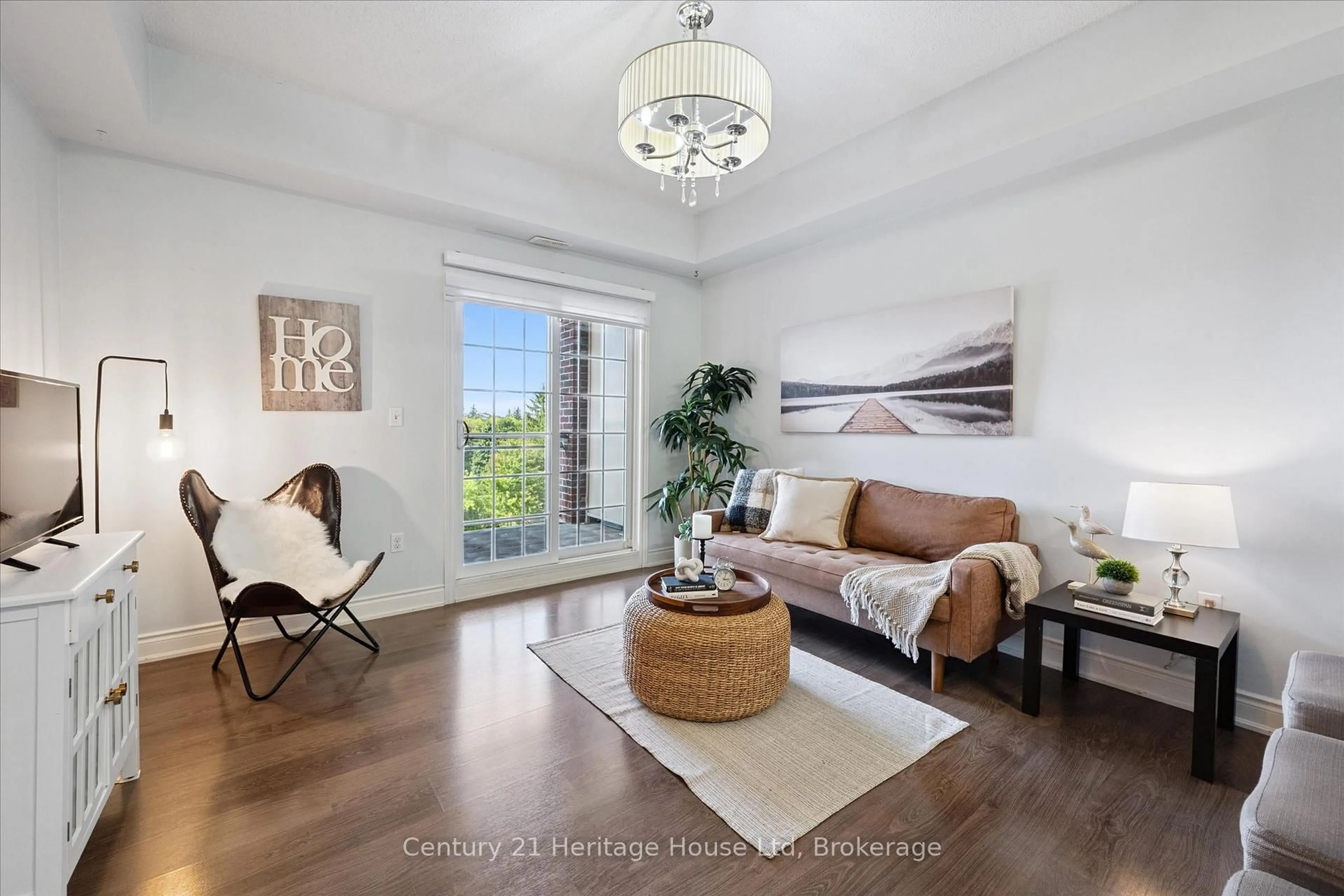 Living room with furniture, wood/laminate floor for 1440 Gordon St #404, Guelph Ontario N1L 1C8