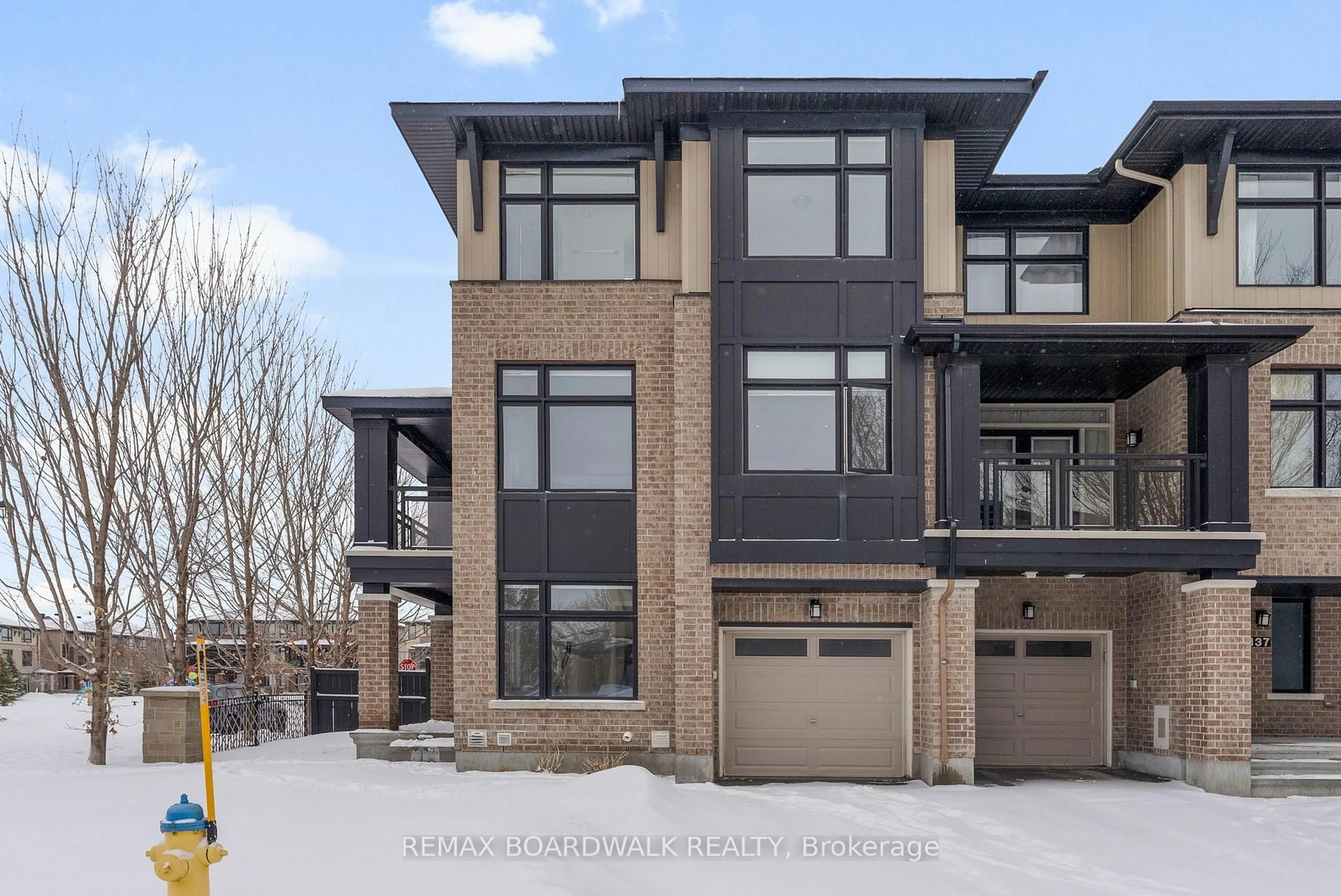 Home with brick exterior material, street for 135 Wild Senna Way, Ottawa Ontario K2J 5Z7