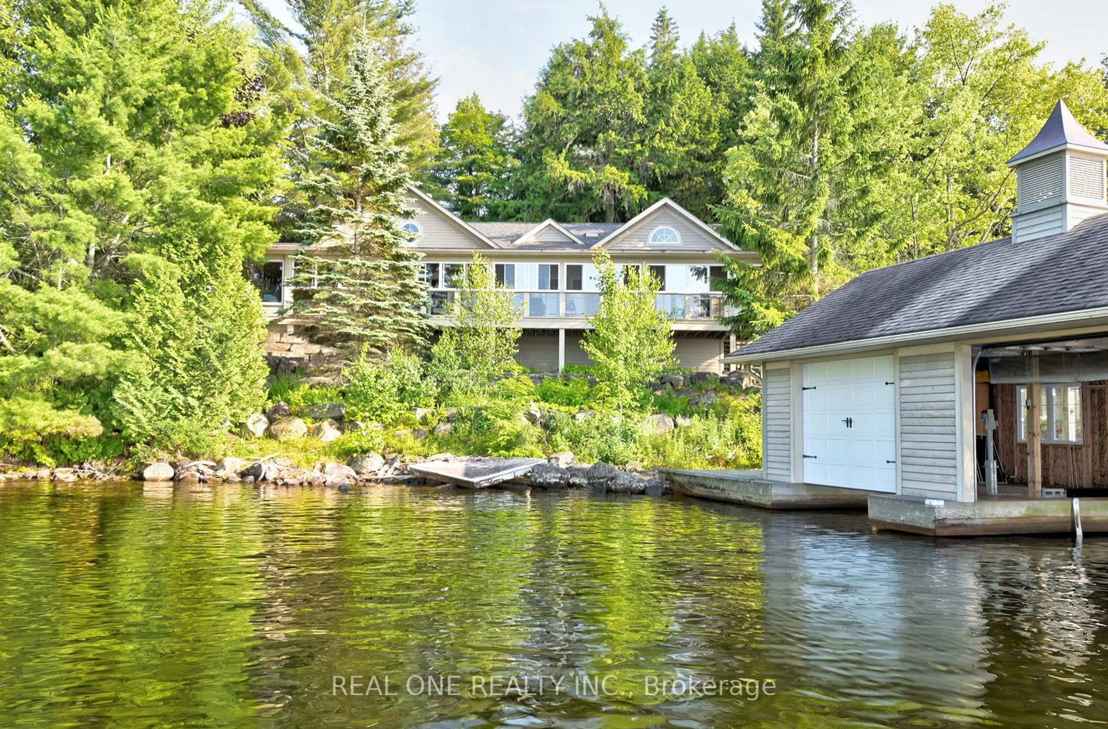 A pic from outside/outdoor area/front of a property/back of a property/a pic from drone, water/lake/river/ocean view for 3013 MUSKOKA ROAD 117, Lake of Bays Ontario P0B 1A0