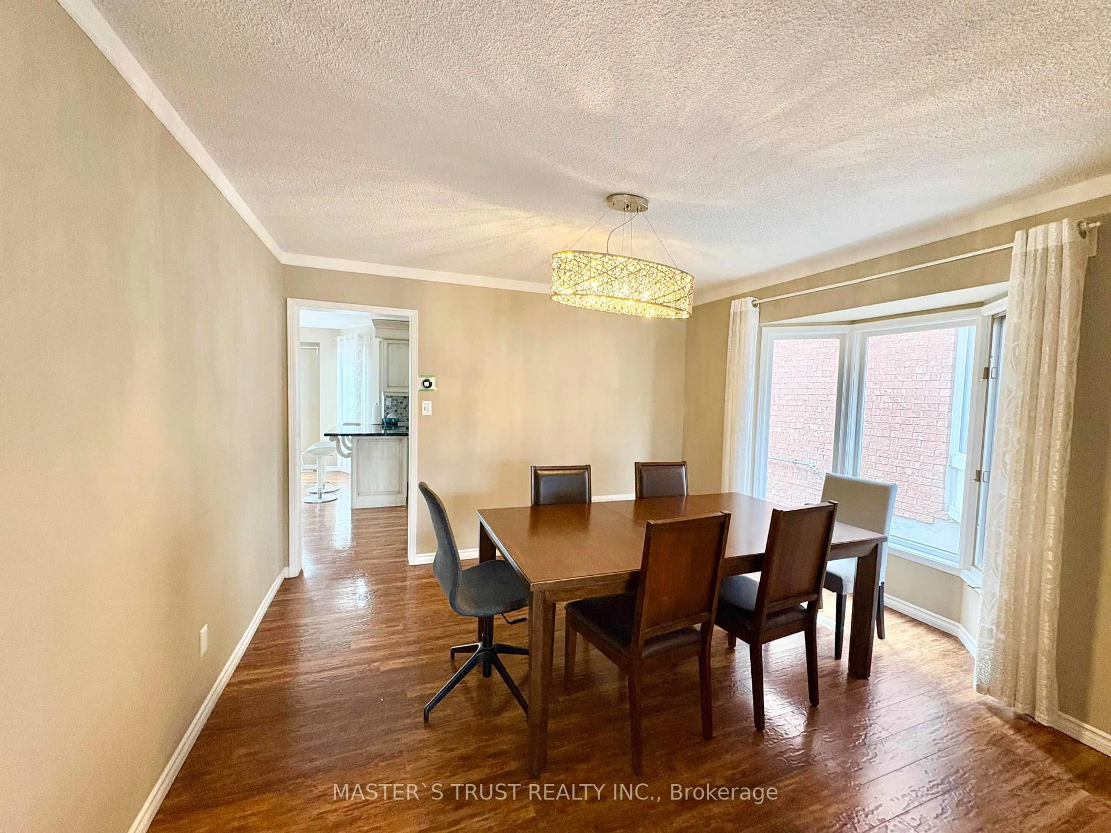 Dining room, wood/laminate floor for 138 Huntingwood Ave, Hamilton Ontario L9H 6X7