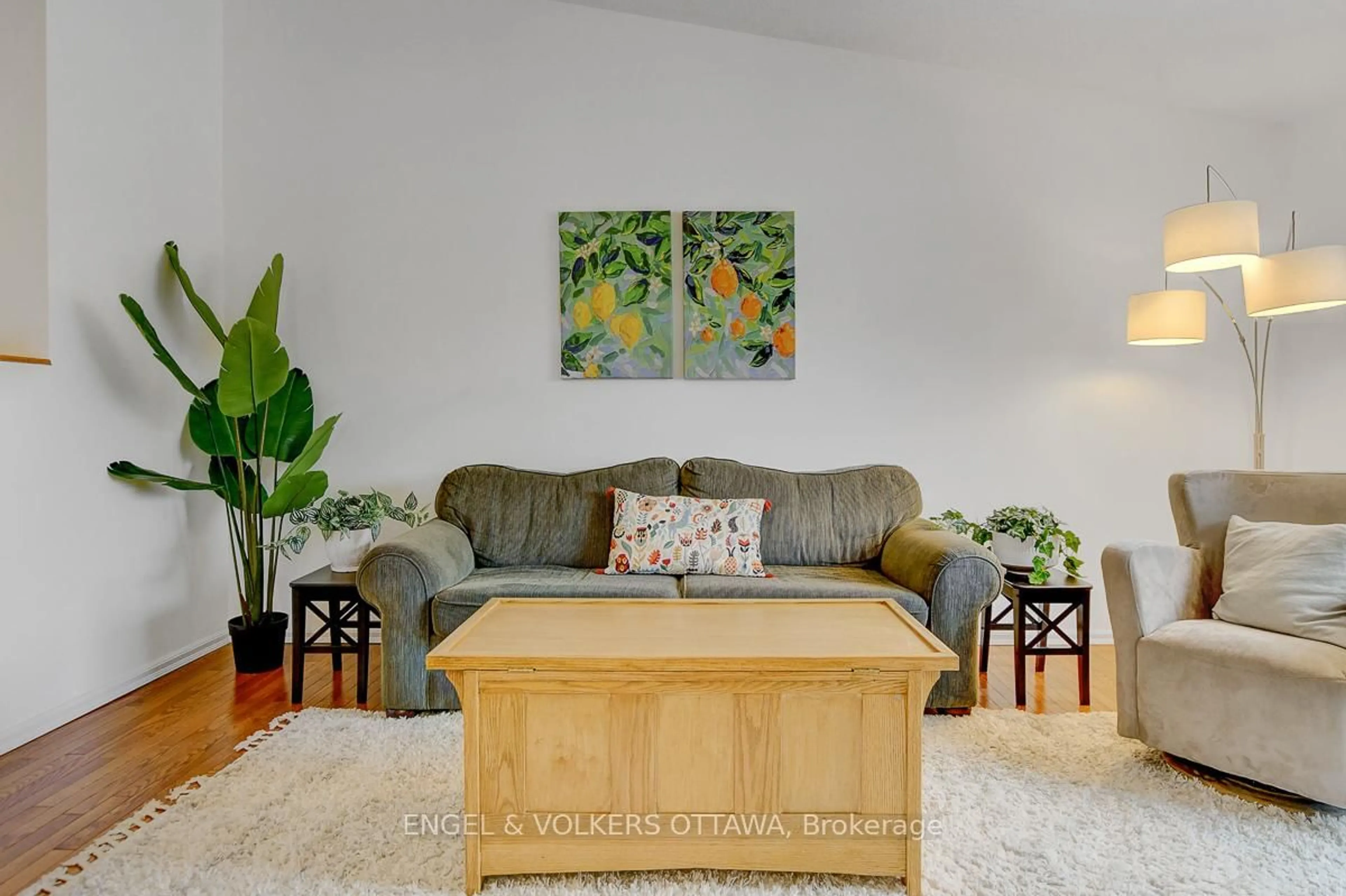 Living room with furniture, wood/laminate floor for 206 Sherway Dr, Nepean Ontario K2J 2G6