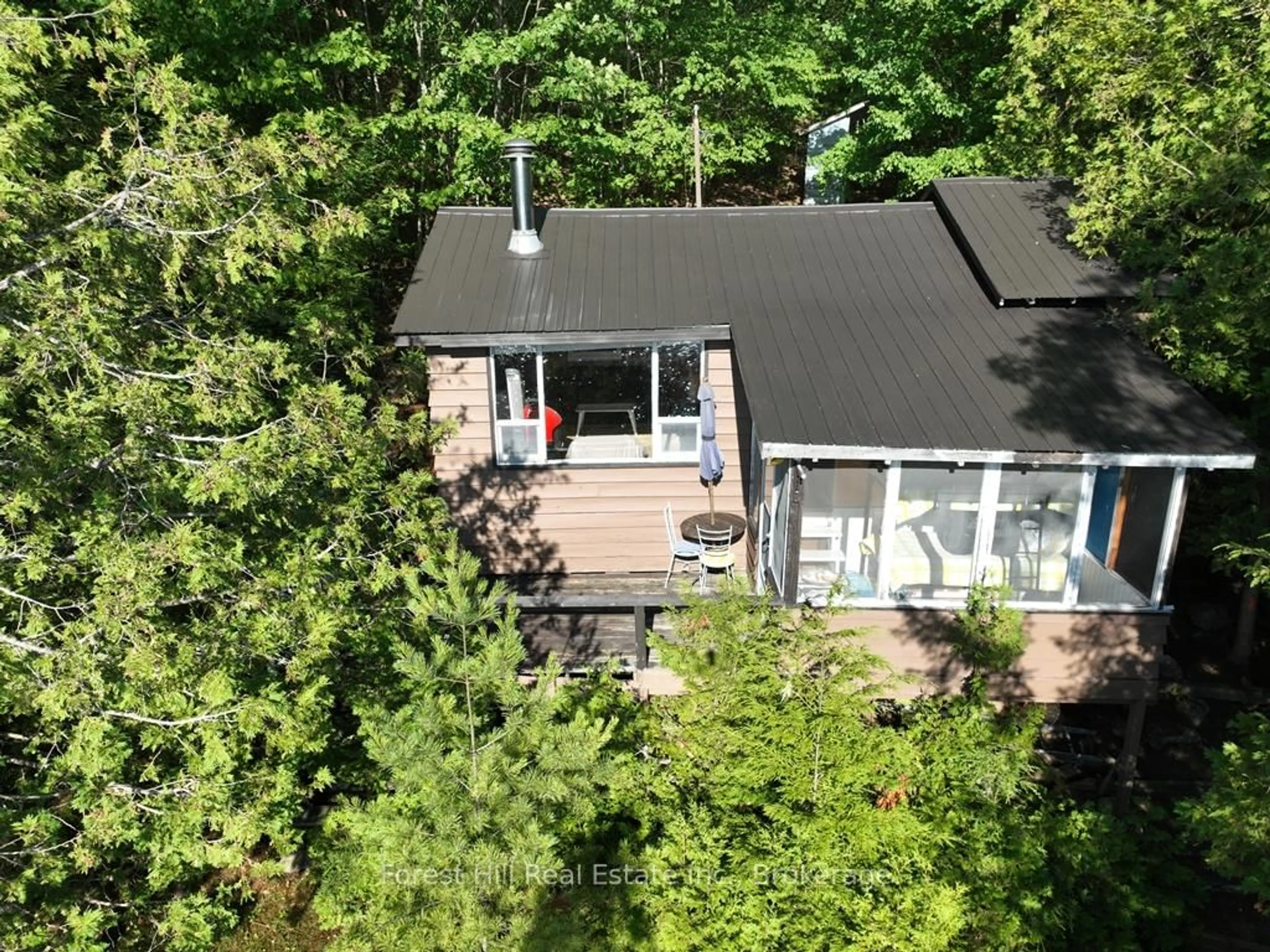 A pic from outside/outdoor area/front of a property/back of a property/a pic from drone, forest/trees view for 10689 Kawagama Lake WAO, Algonquin Highlands Ontario P0A 1E0