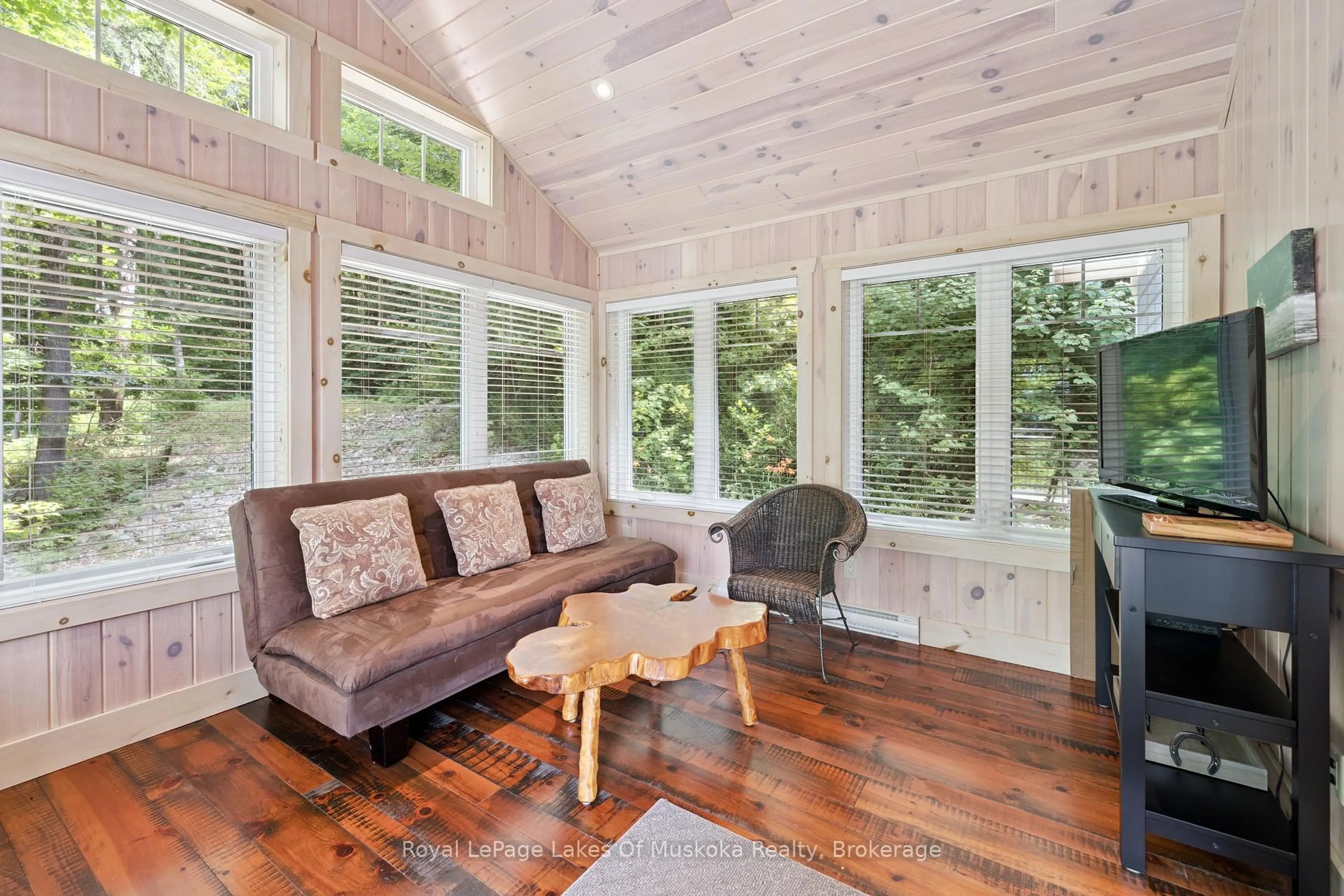Living room with furniture, wood/laminate floor for 16368 Kawagama-Dennison Island, Dysart et al Ontario K0M 1S0