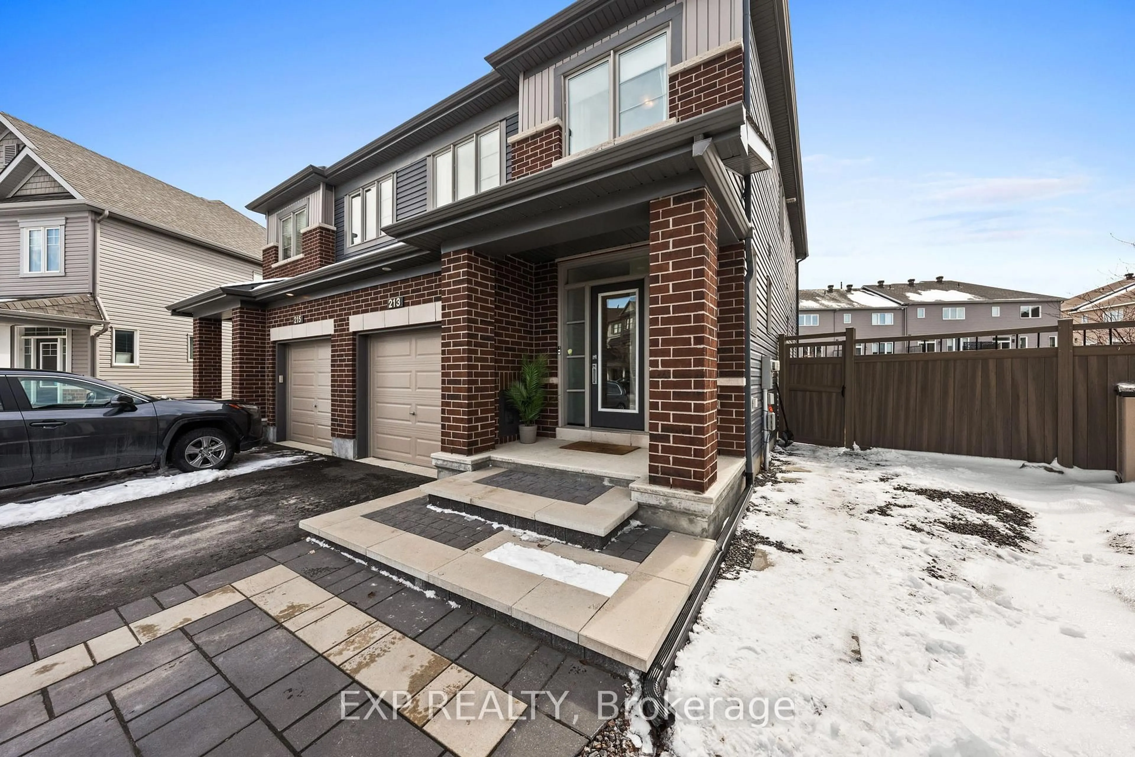 Home with brick exterior material, street for 213 Belleek Lane, Ottawa Ontario K2J 6G2