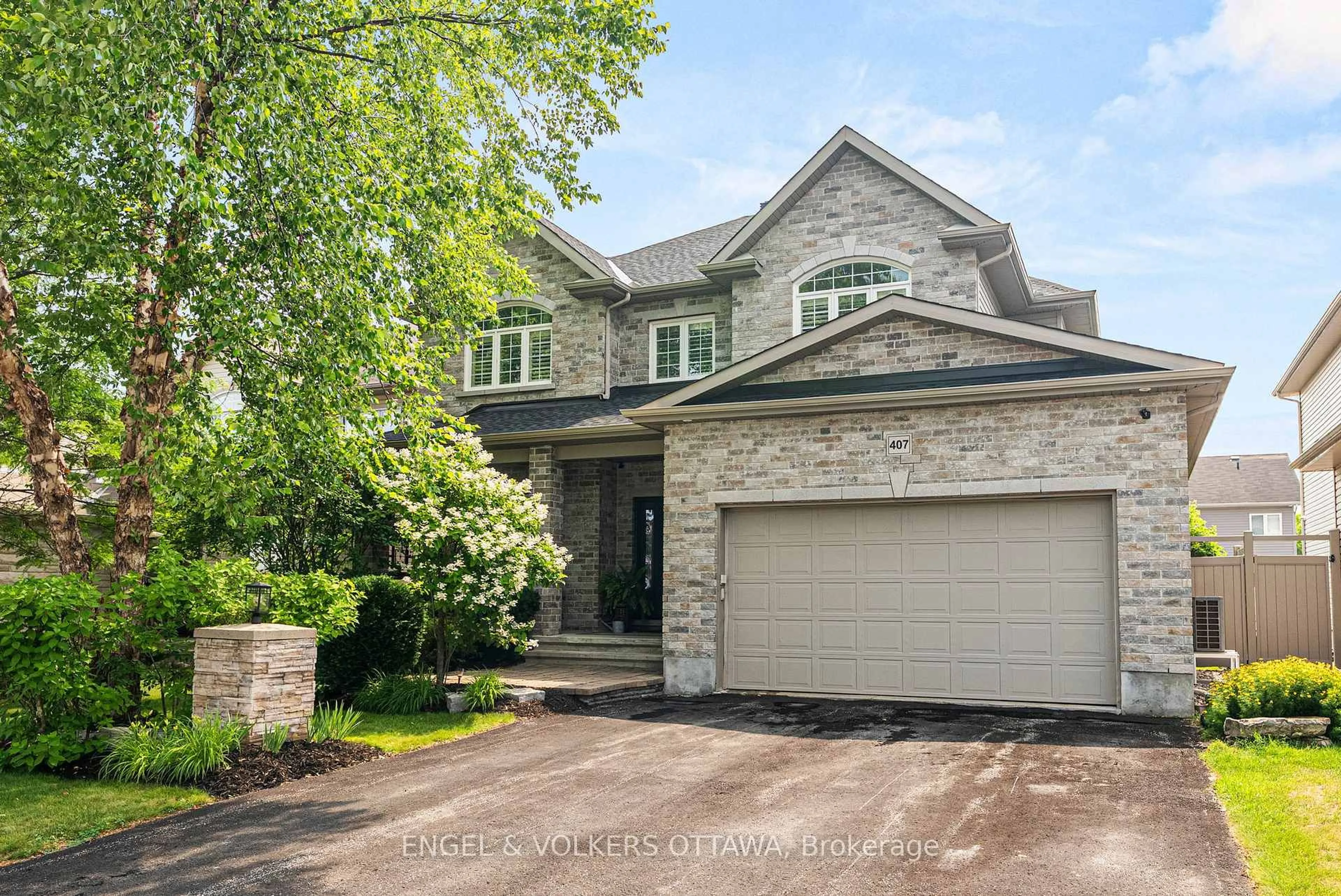 Home with brick exterior material, street for 407 Landswood Way, Ottawa Ontario K2S 0A3