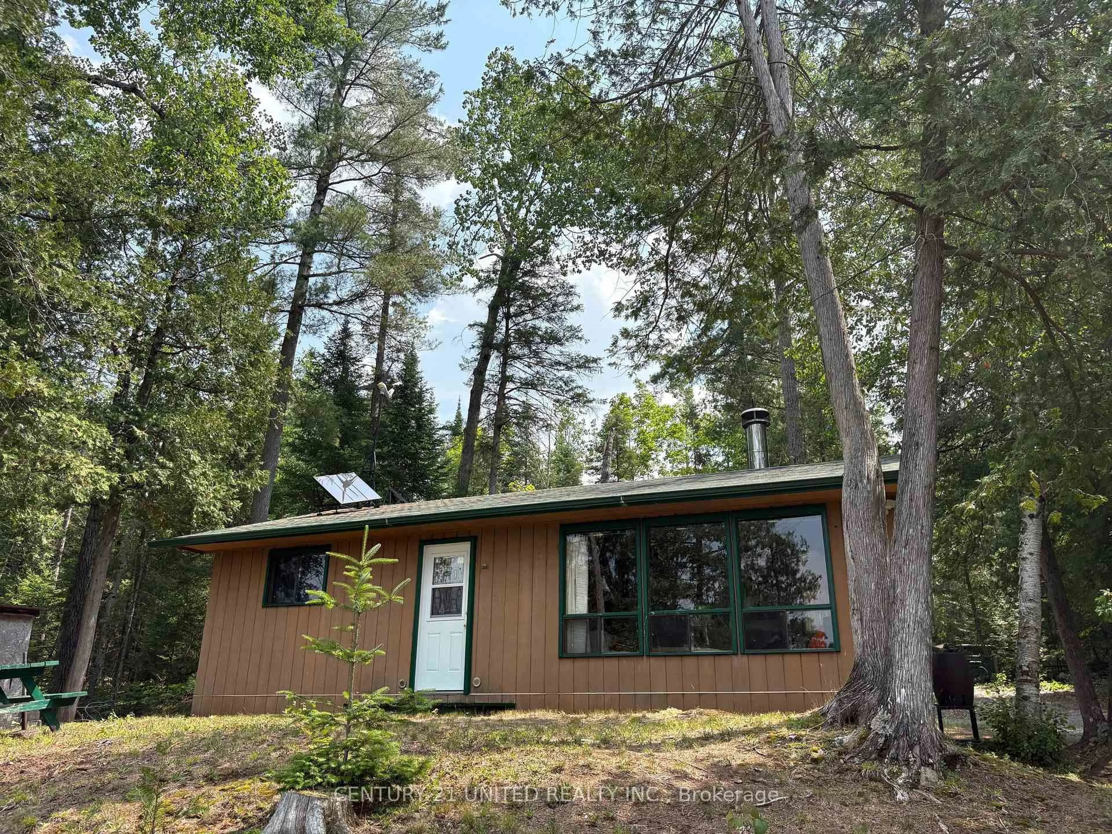 Home with vinyl exterior material, forest/trees view for 16 Fire Route 311, Trent Lakes Ontario K0L 1J0