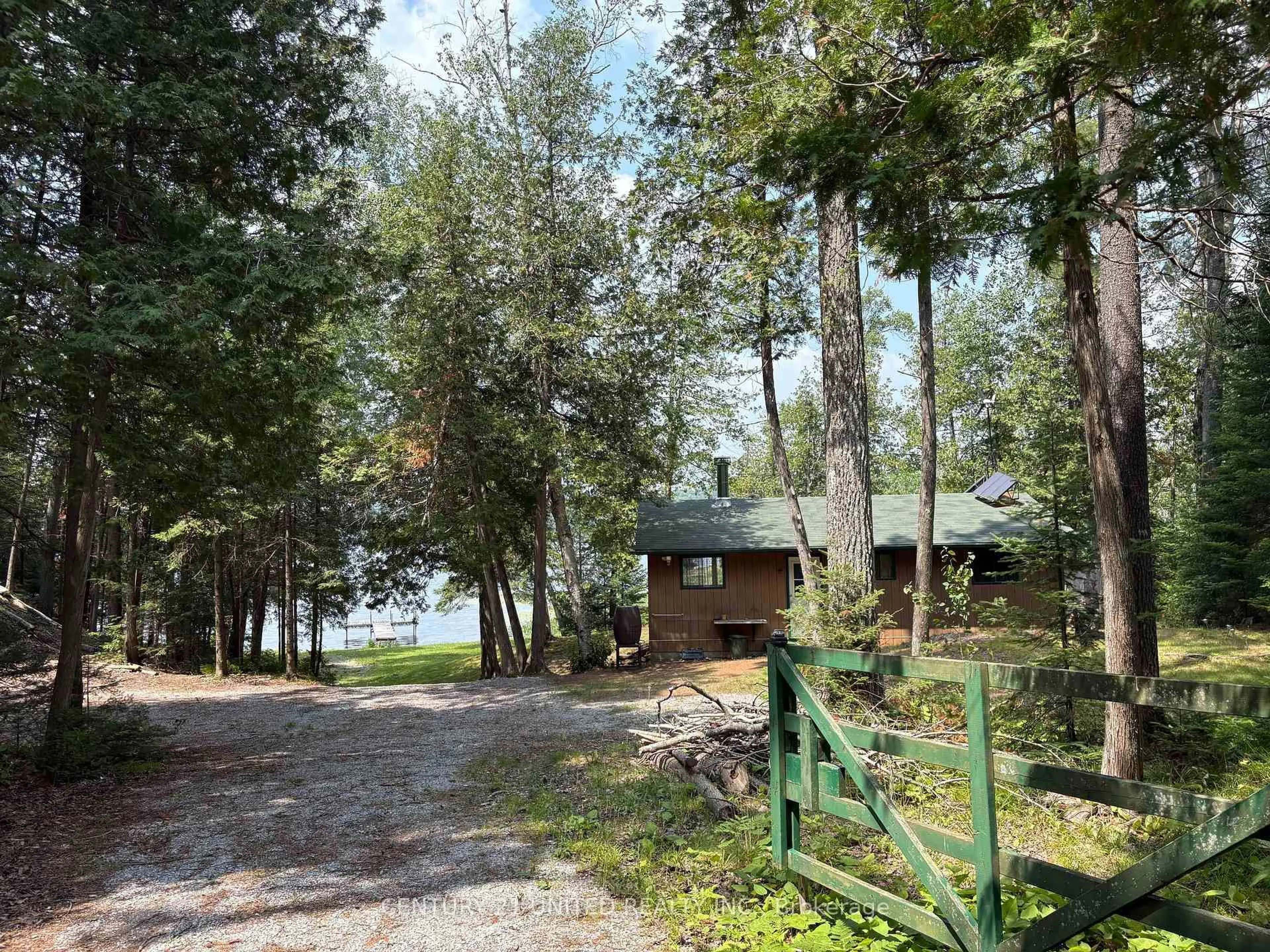 A pic from outside/outdoor area/front of a property/back of a property/a pic from drone, water/lake/river/ocean view for 16 Fire Route 311, Trent Lakes Ontario K0L 1J0