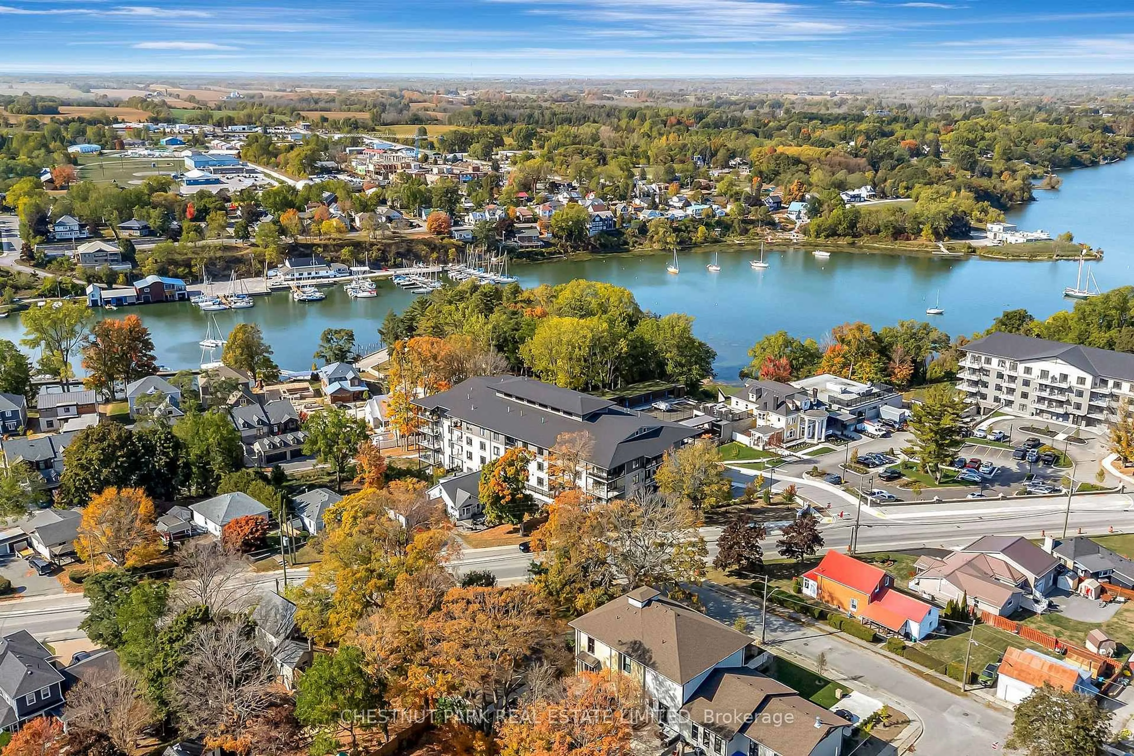 A pic from outside/outdoor area/front of a property/back of a property/a pic from drone, water/lake/river/ocean view for 17 Cleave Ave #102, Prince Edward County Ontario K0K 2T0