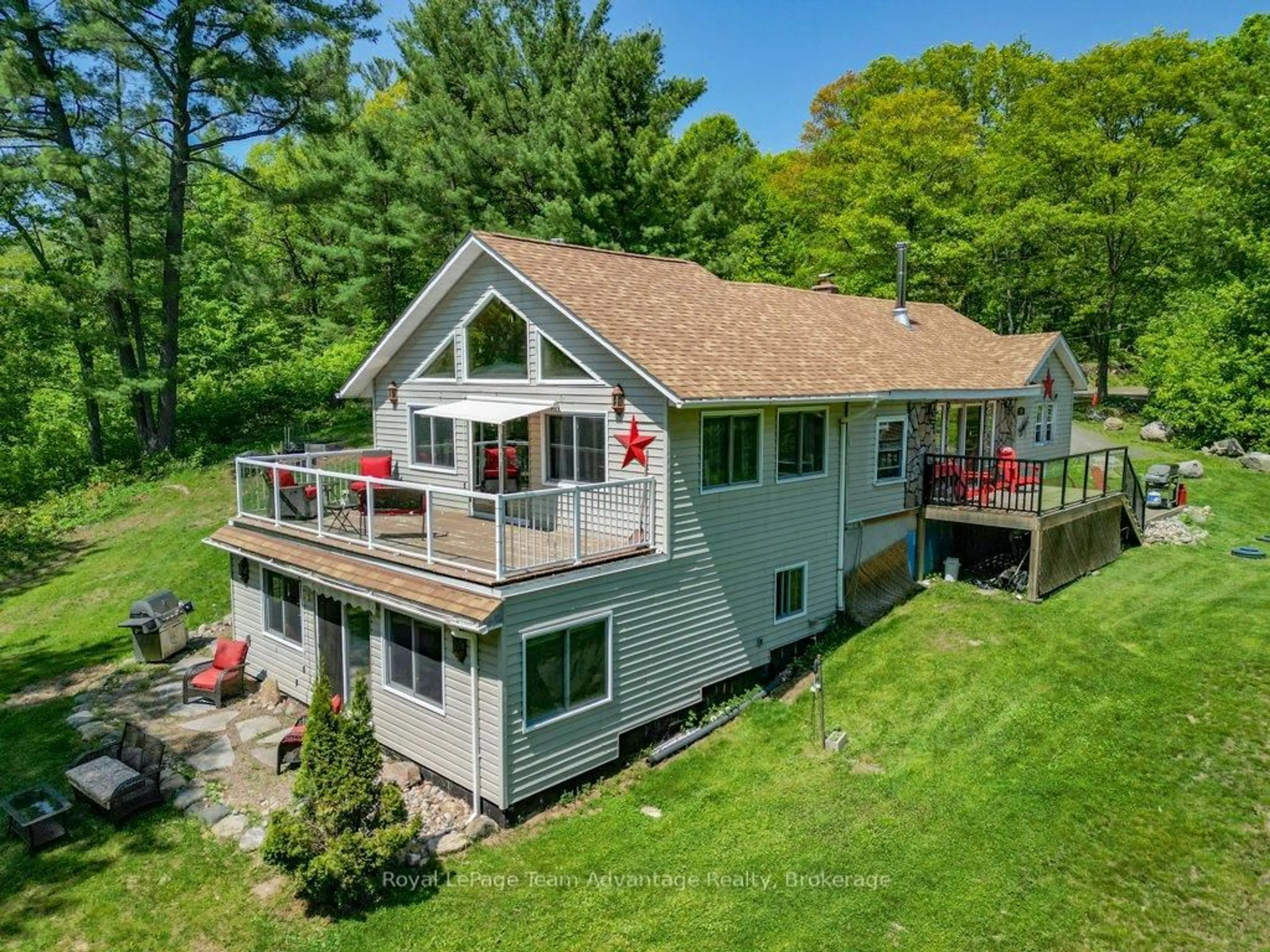A pic from outside/outdoor area/front of a property/back of a property/a pic from drone, water/lake/river/ocean view for 19 Allan Cres, Seguin Ontario P2A 2W8