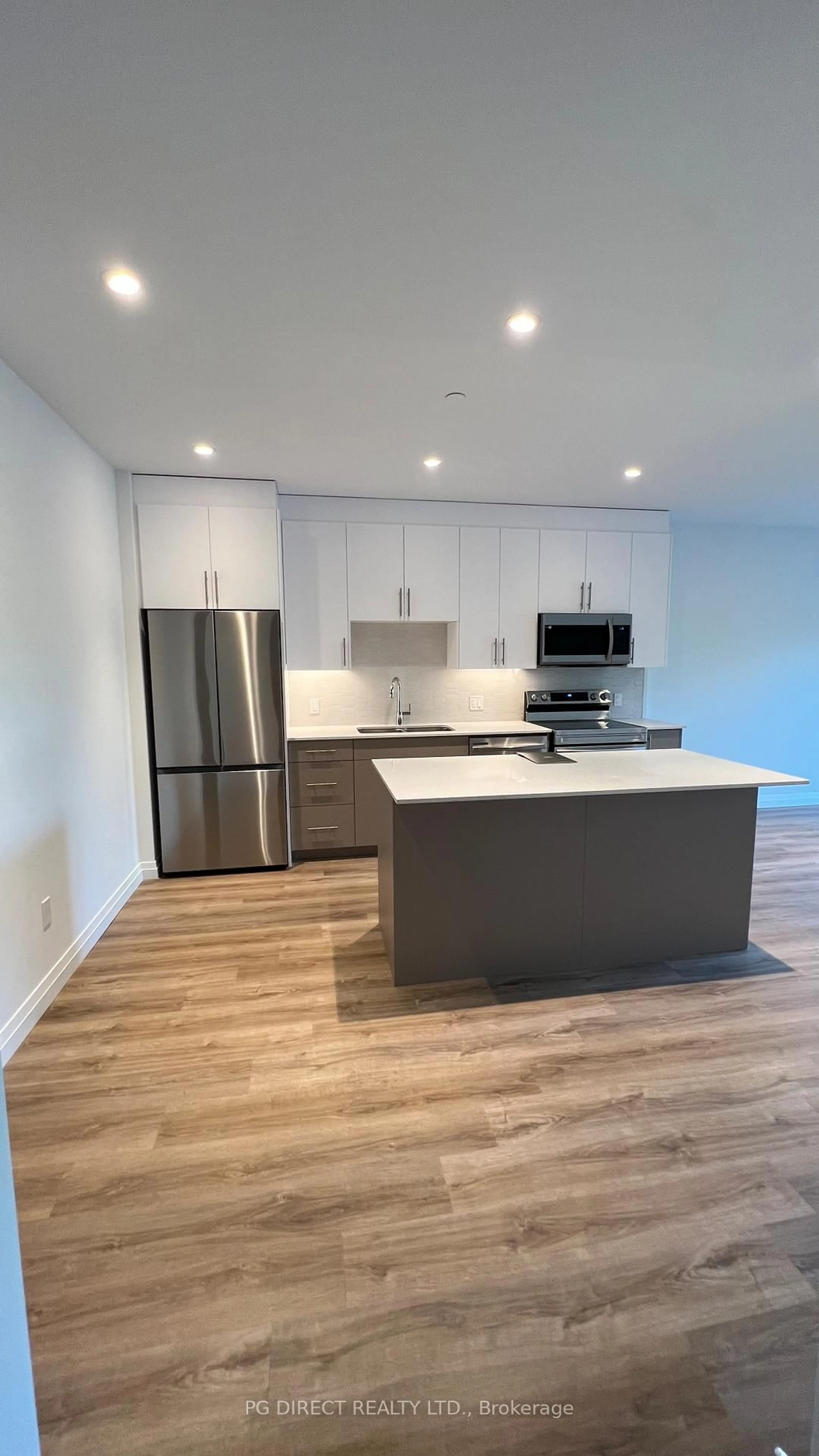 Open concept kitchen, wood/laminate floor for 525 New Dundee Rd #413, Kitchener Ontario N2P 0K8