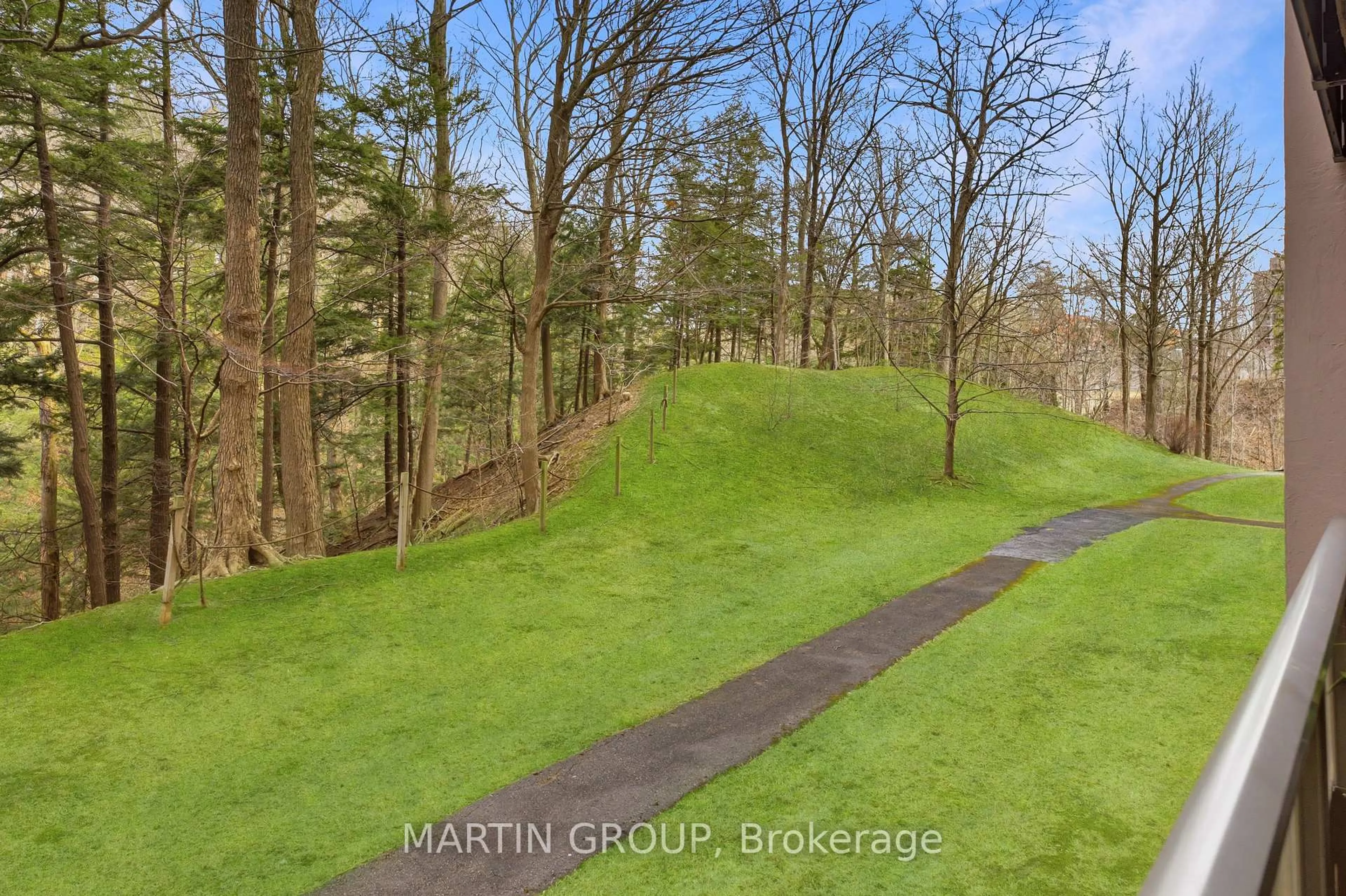 A pic from outside/outdoor area/front of a property/back of a property/a pic from drone, forest/trees view for 1968 Main St #103, Hamilton Ontario L8S 1J7