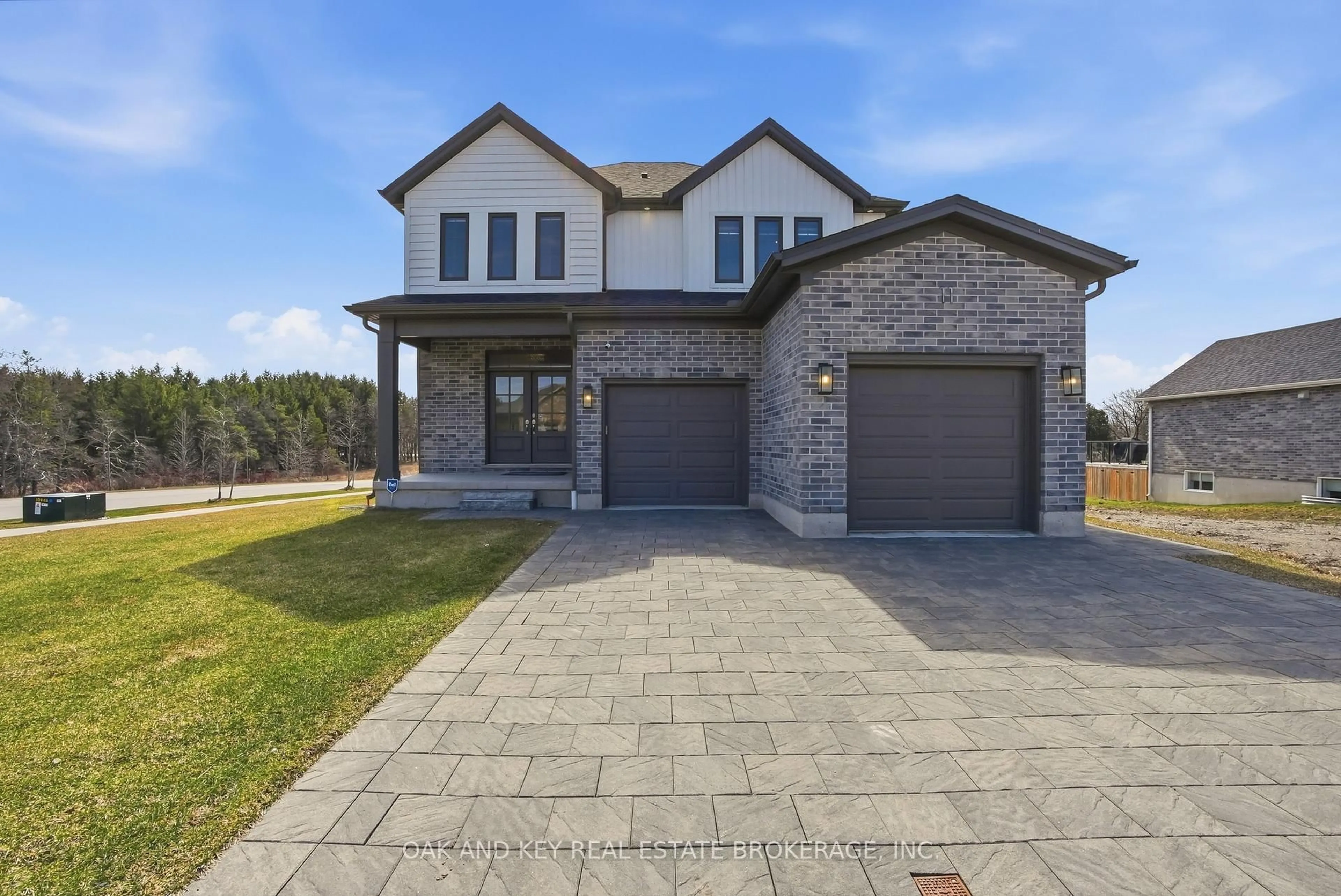 Home with brick exterior material, street for 11 Bowman Dr, Middlesex Centre Ontario N0M 2A0