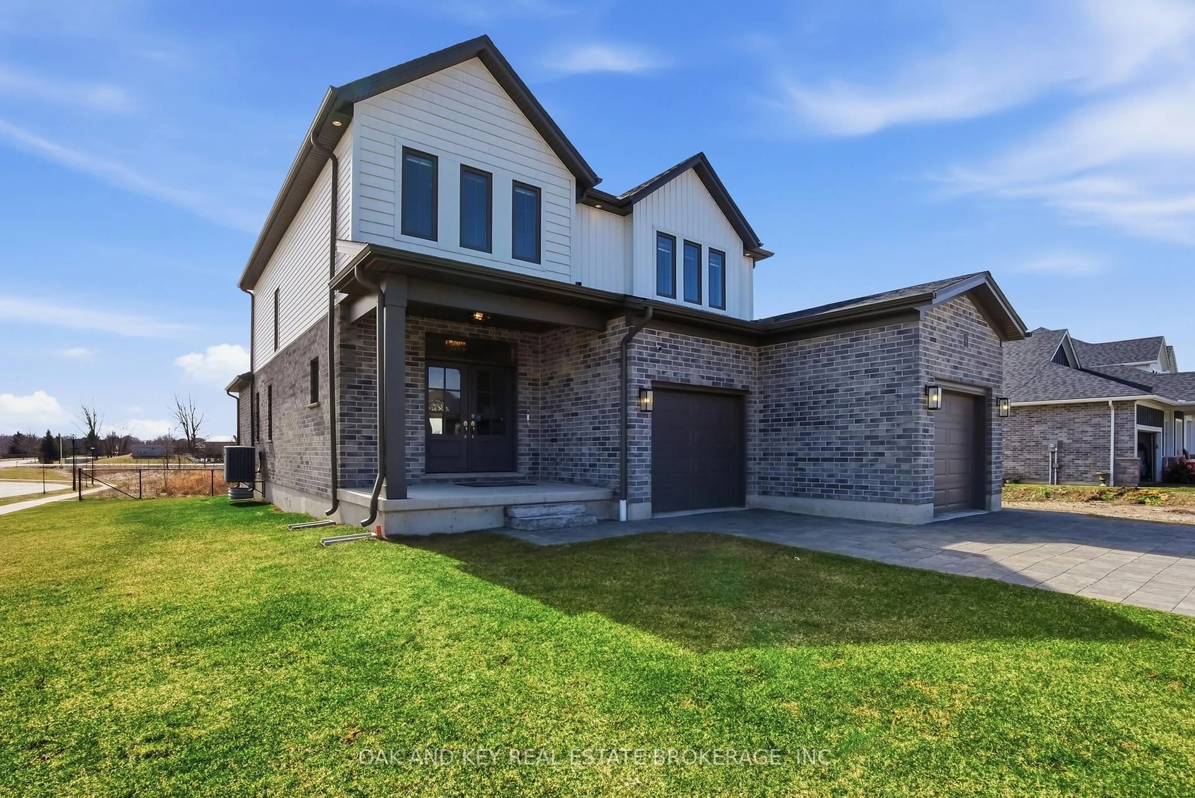 Home with brick exterior material, street for 11 Bowman Dr, Middlesex Centre Ontario N0M 2A0