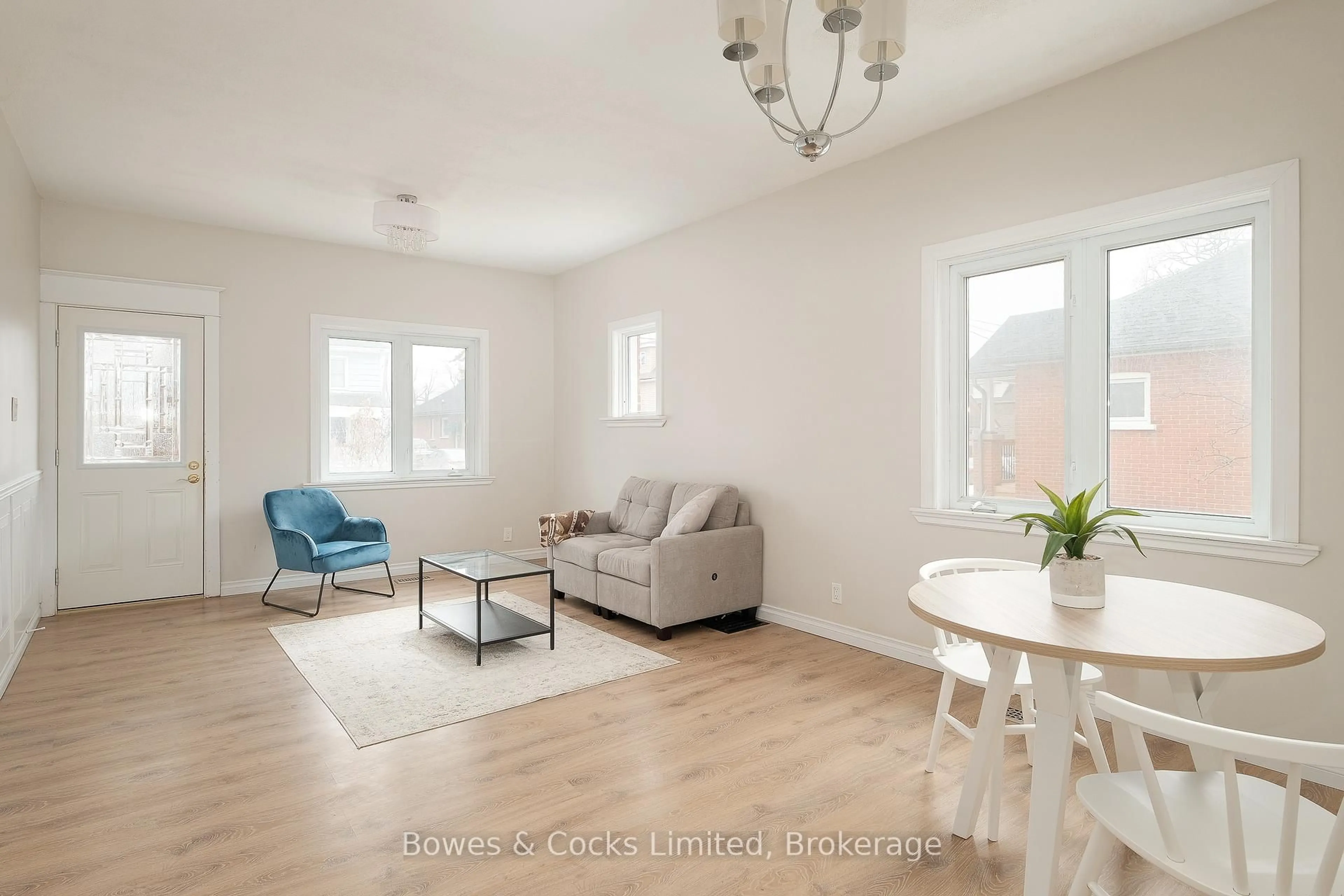 Living room with furniture, wood/laminate floor for 164 Prince St, Peterborough Ontario K9J 2A4