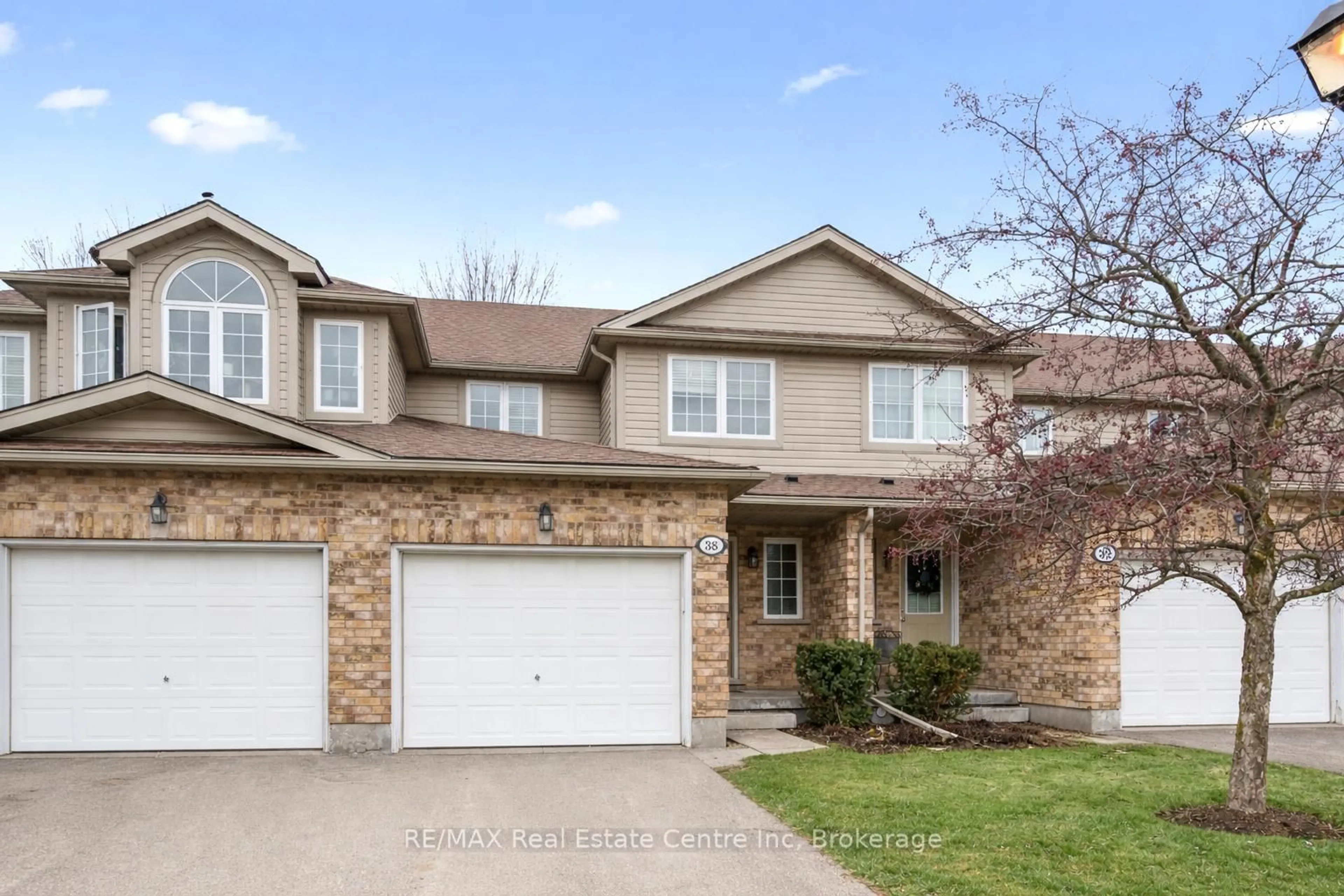 Home with brick exterior material, street for 210 DAWN Ave #38, Guelph Ontario N1G 5L5