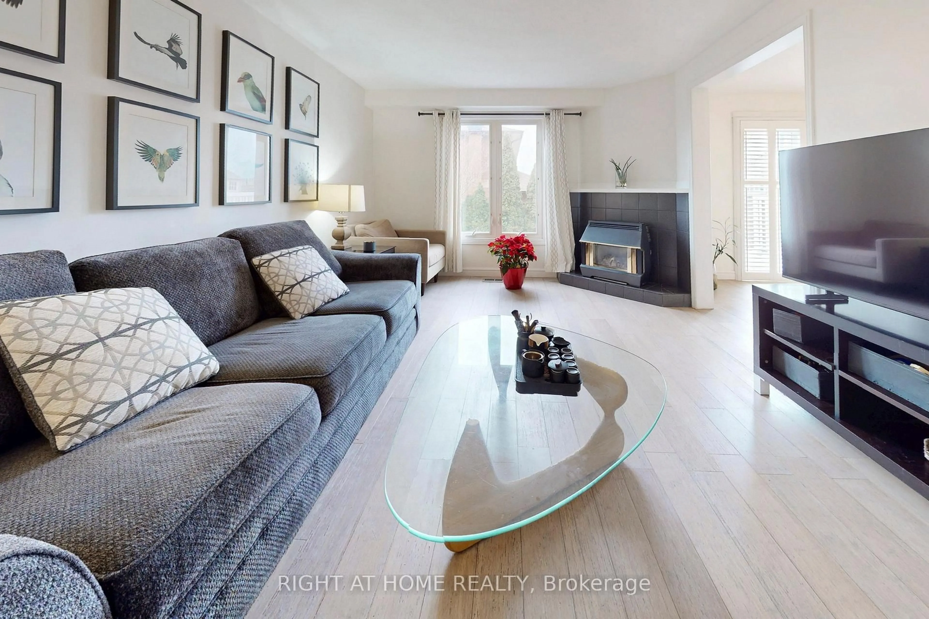 Living room with furniture, wood/laminate floor for 62 Como Pl, Hamilton Ontario L9B 1Y4