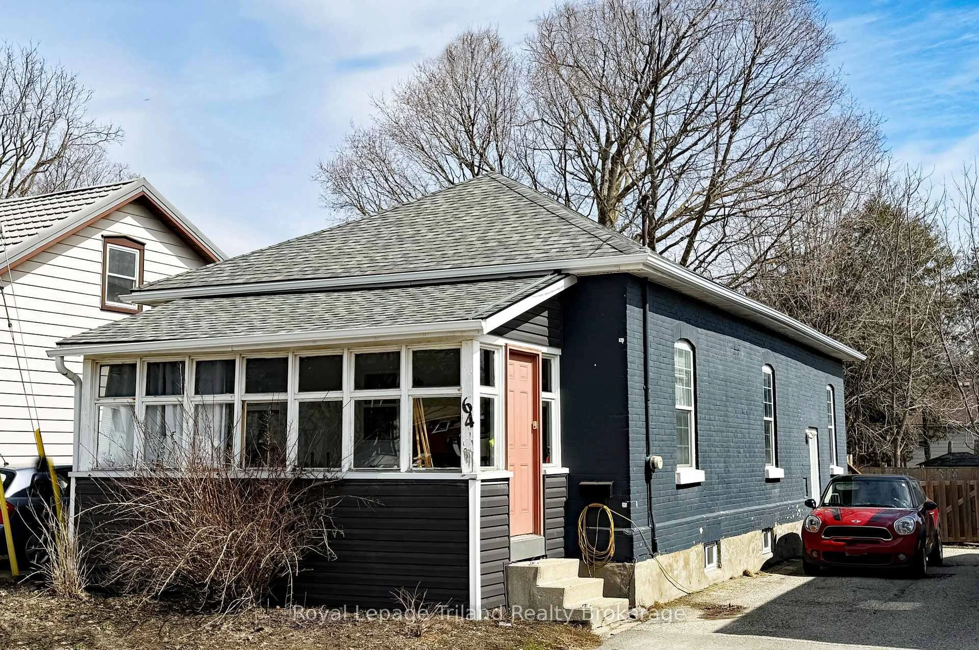 Home with vinyl exterior material, street for 64 Huron St, Woodstock Ontario N4S 6Z3