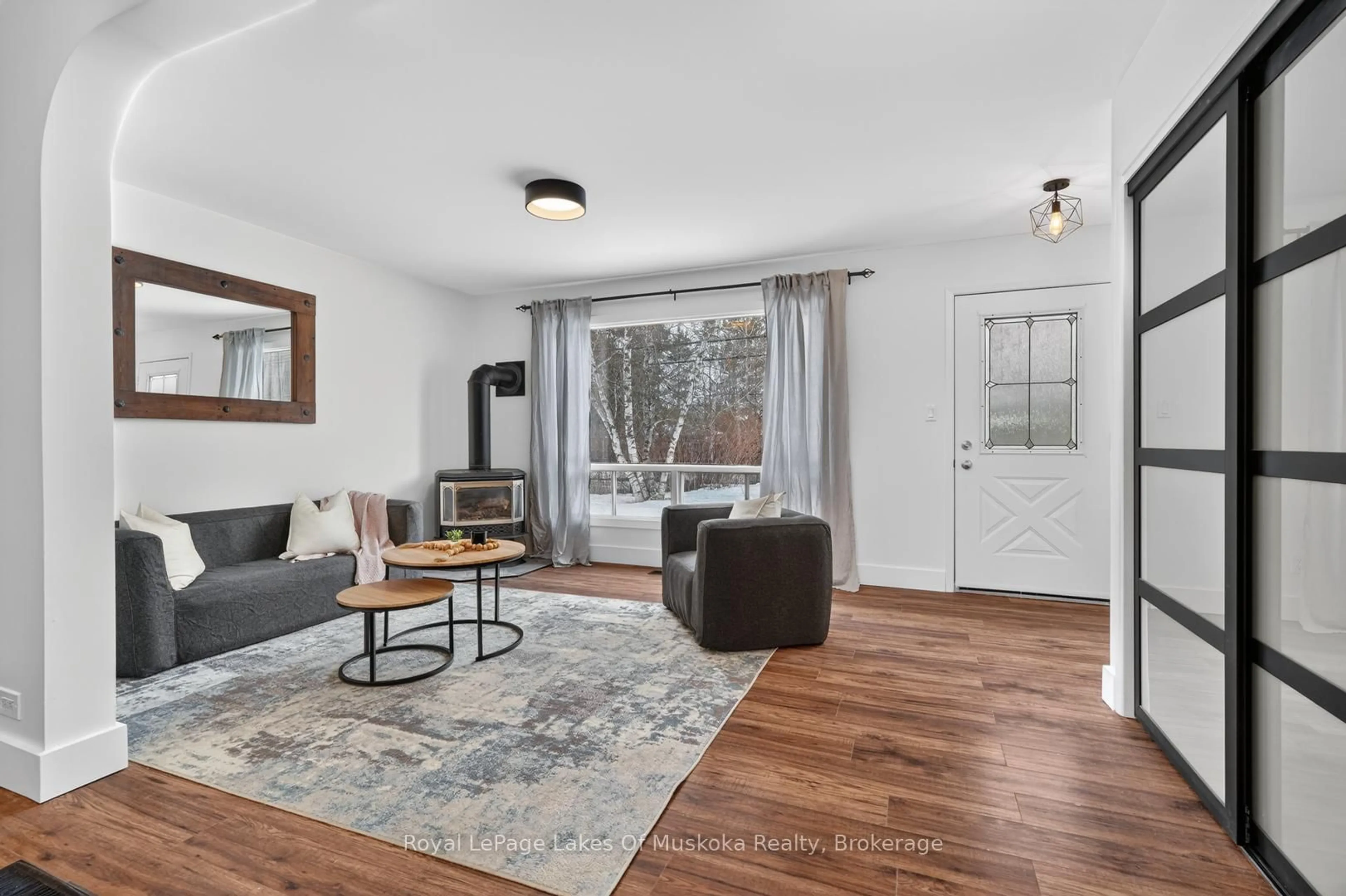 Living room with furniture, wood/laminate floor for 11 Silver St, Huntsville Ontario P1H 1M2