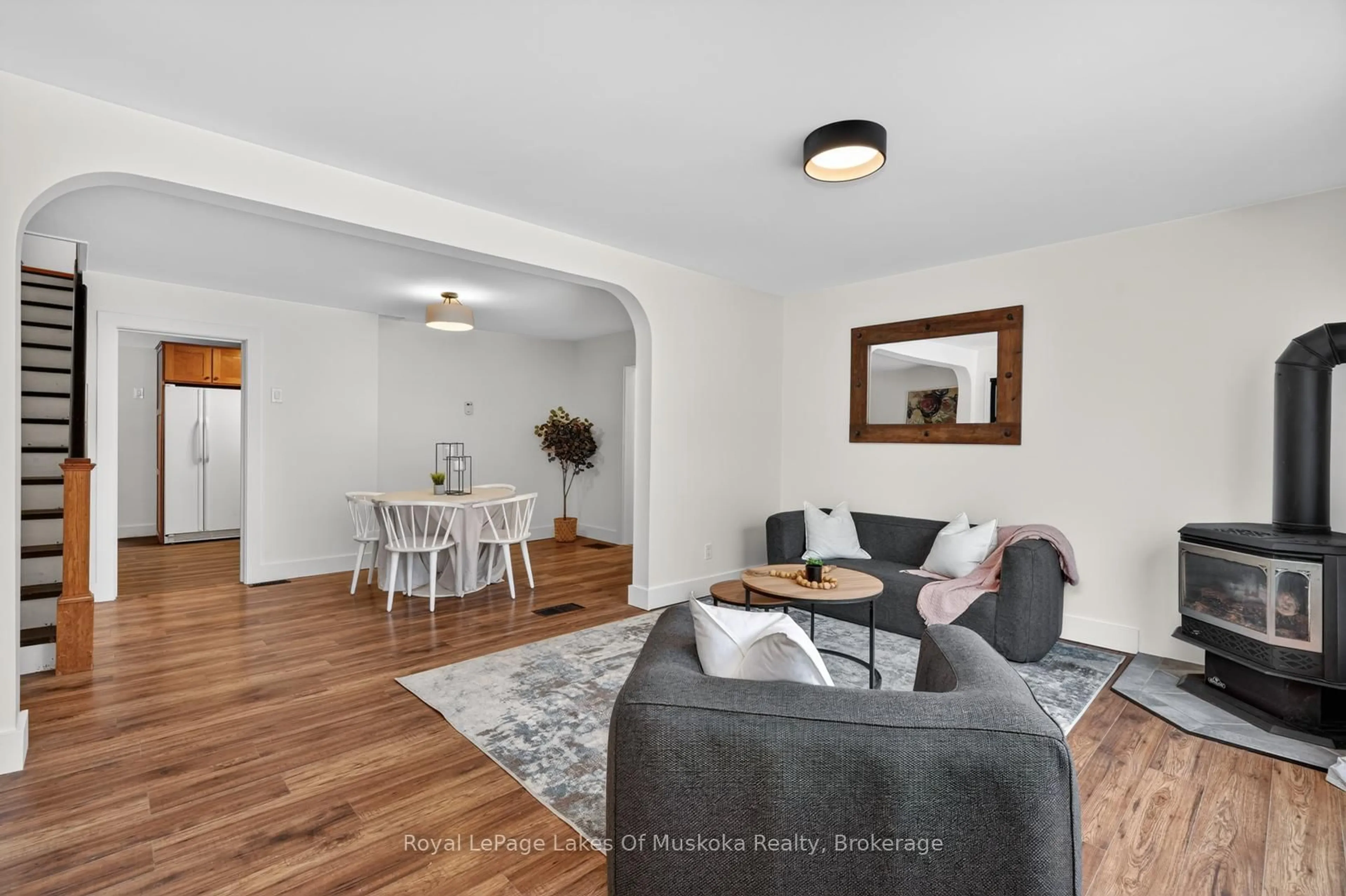 Living room with furniture, wood/laminate floor for 11 Silver St, Huntsville Ontario P1H 1M2