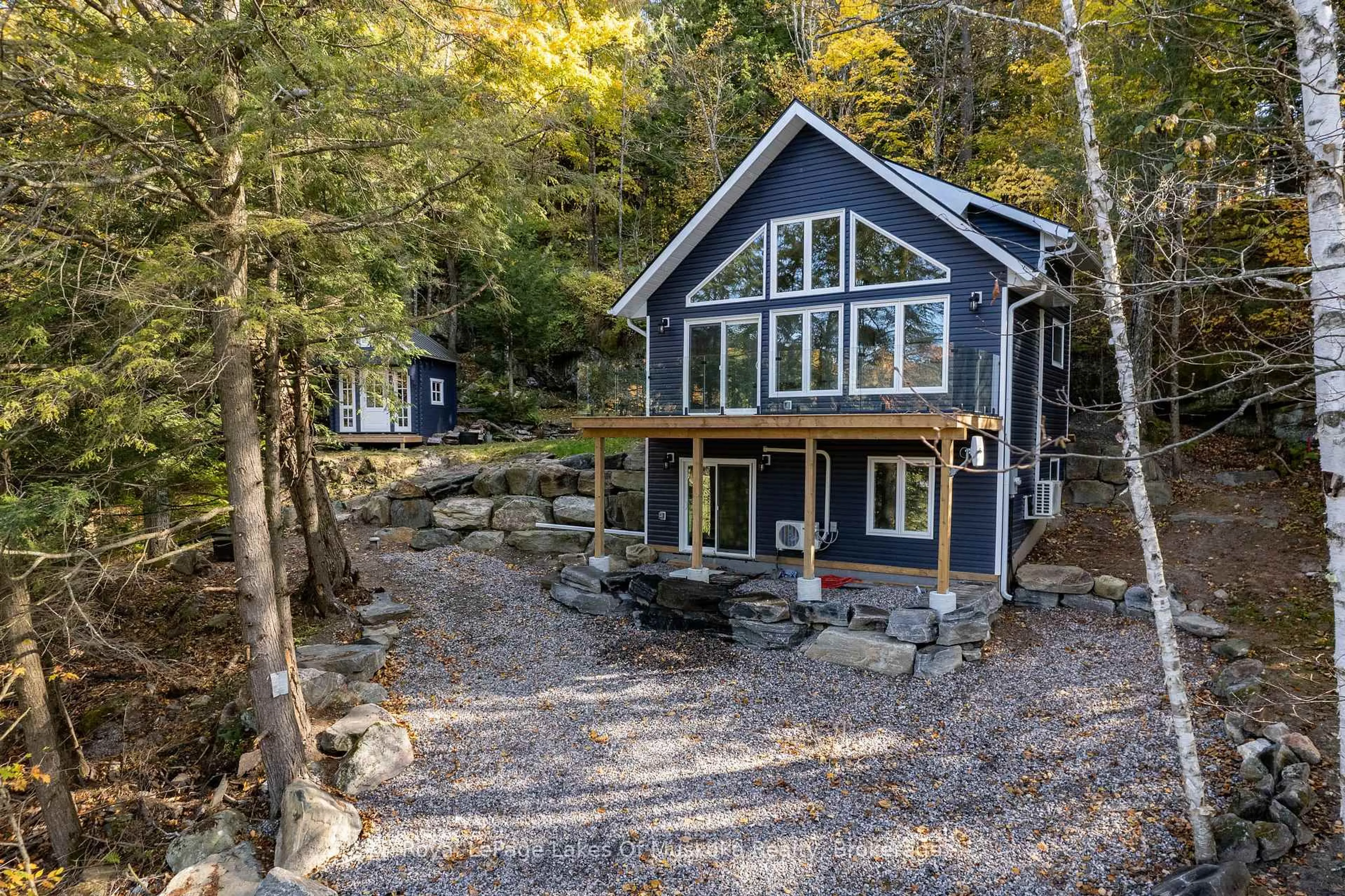 A pic from outside/outdoor area/front of a property/back of a property/a pic from drone, water/lake/river/ocean view for 1361 Rosseau Lake 2 Rd, Muskoka Lakes Ontario P0B 1M0