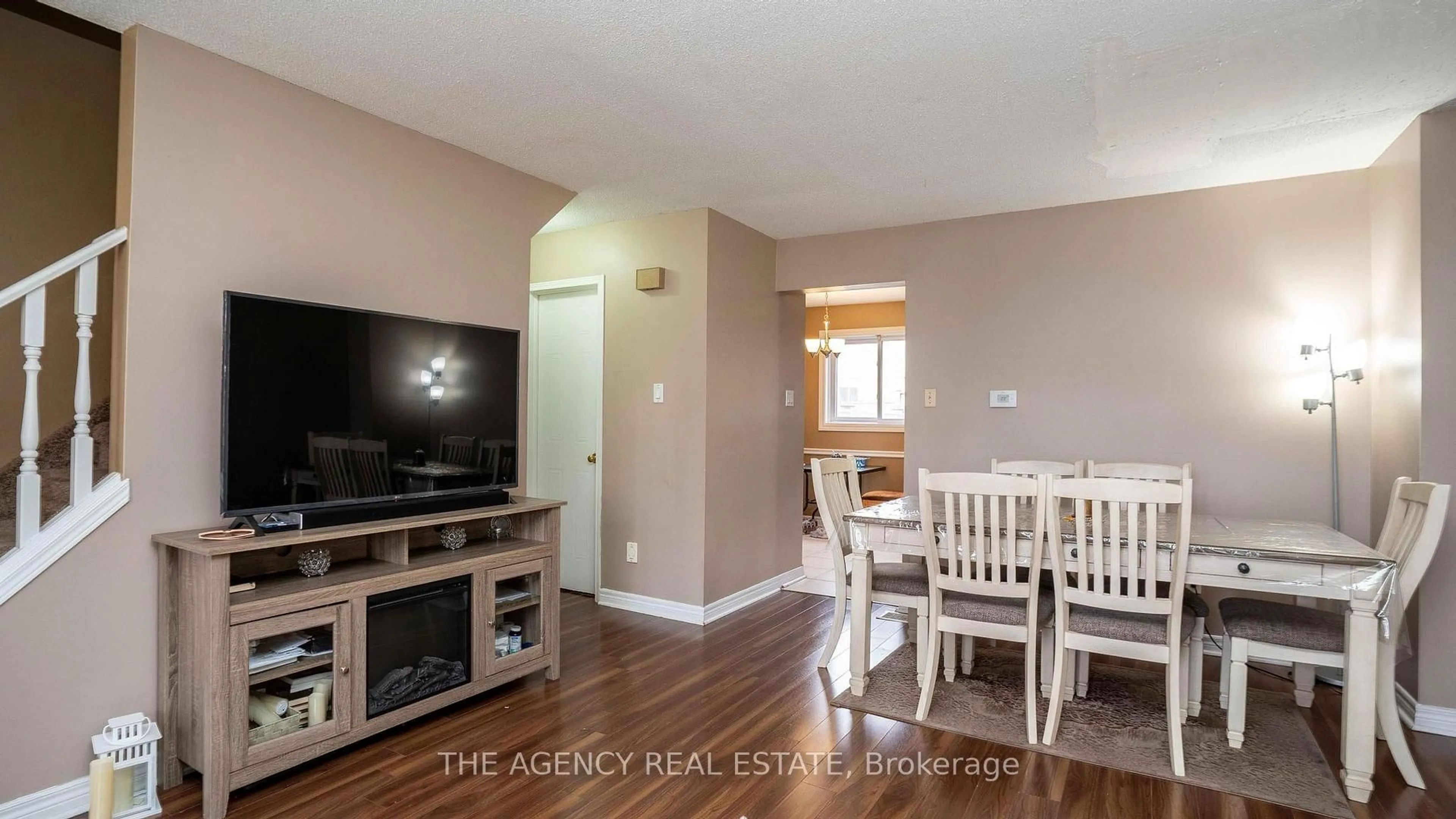 Living room with furniture, wood/laminate floor for 1095 Jalna Blvd #40, London South Ontario N6E 2Y7