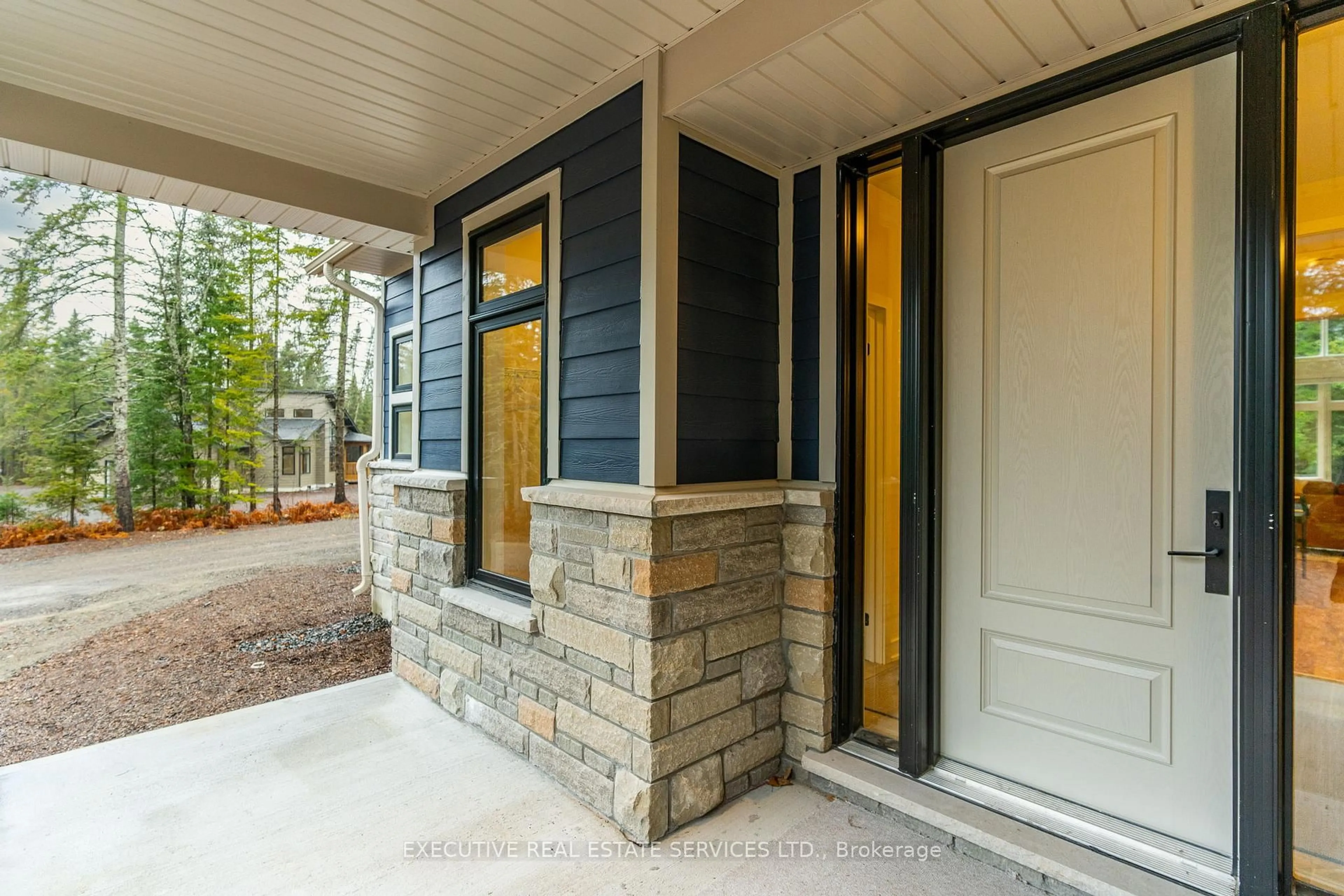 Home with vinyl exterior material, street for 1049 Greensview Dr, Lake of Bays Ontario P1H 0K1