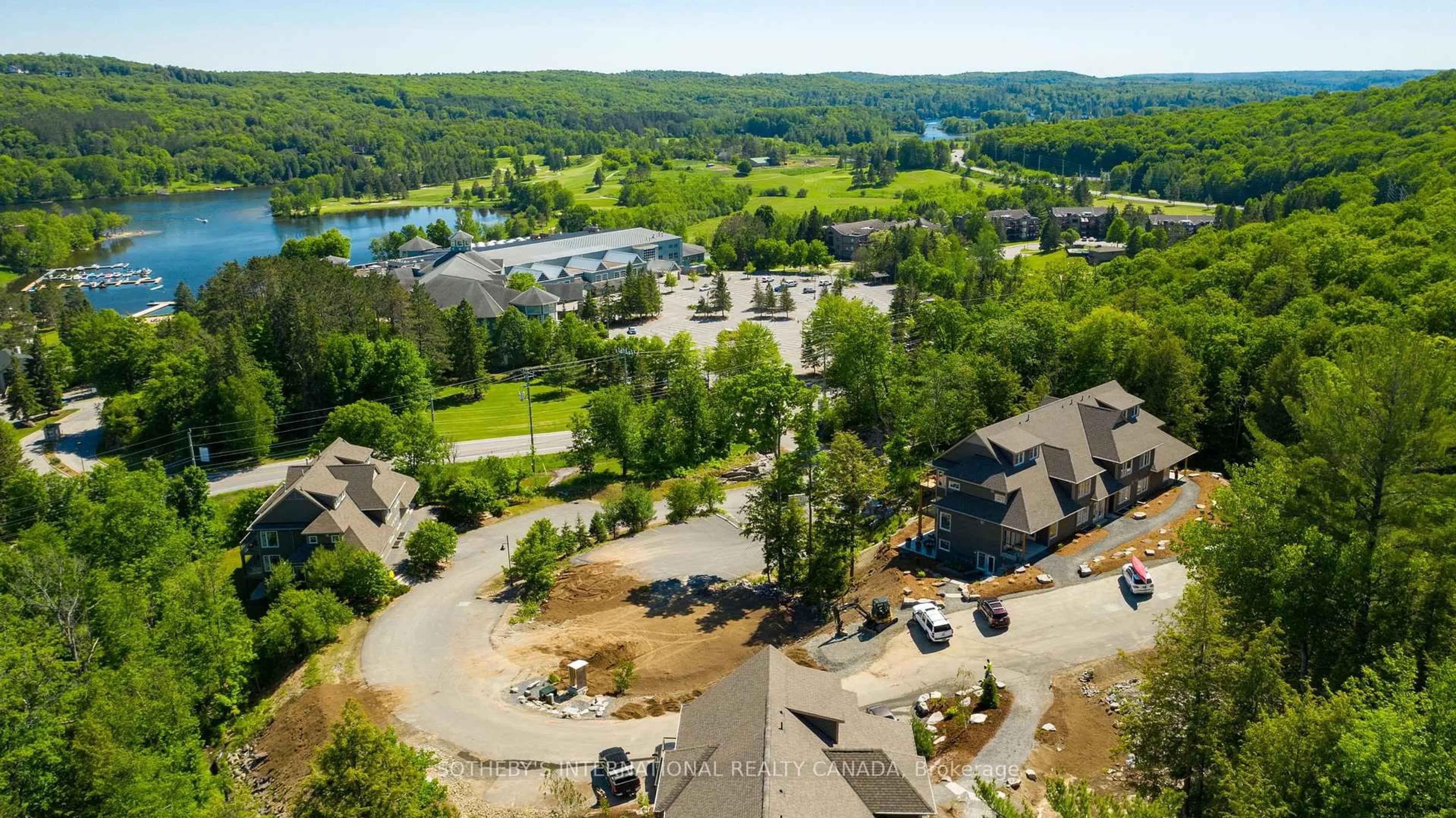 A pic from outside/outdoor area/front of a property/back of a property/a pic from drone, water/lake/river/ocean view for 3 TREE TOPS Lane #302, Huntsville Ontario P1H 1A9