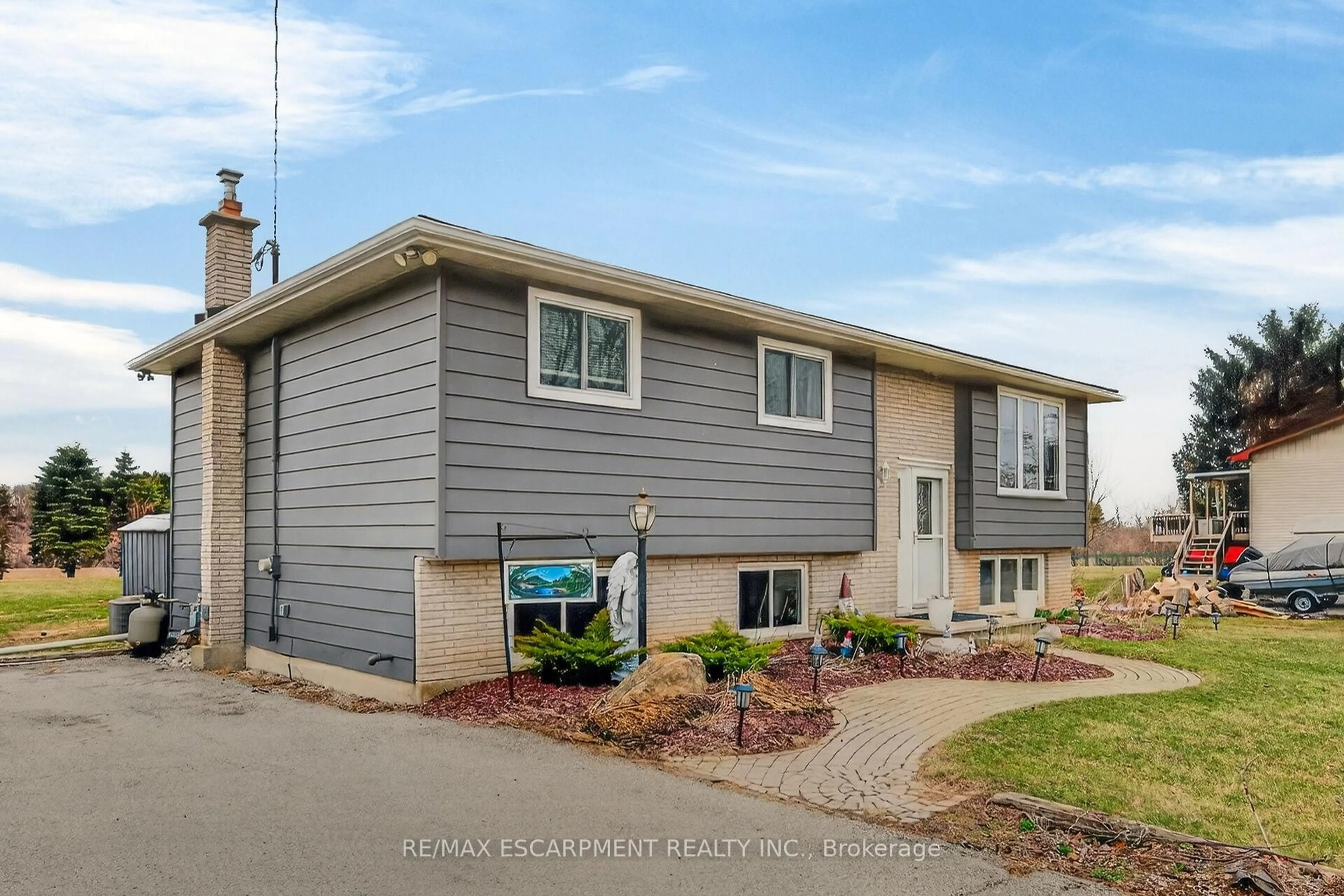 Home with vinyl exterior material, street for 1481 Norfolk County Rd 19 E, Norfolk Ontario N0E 1Z0