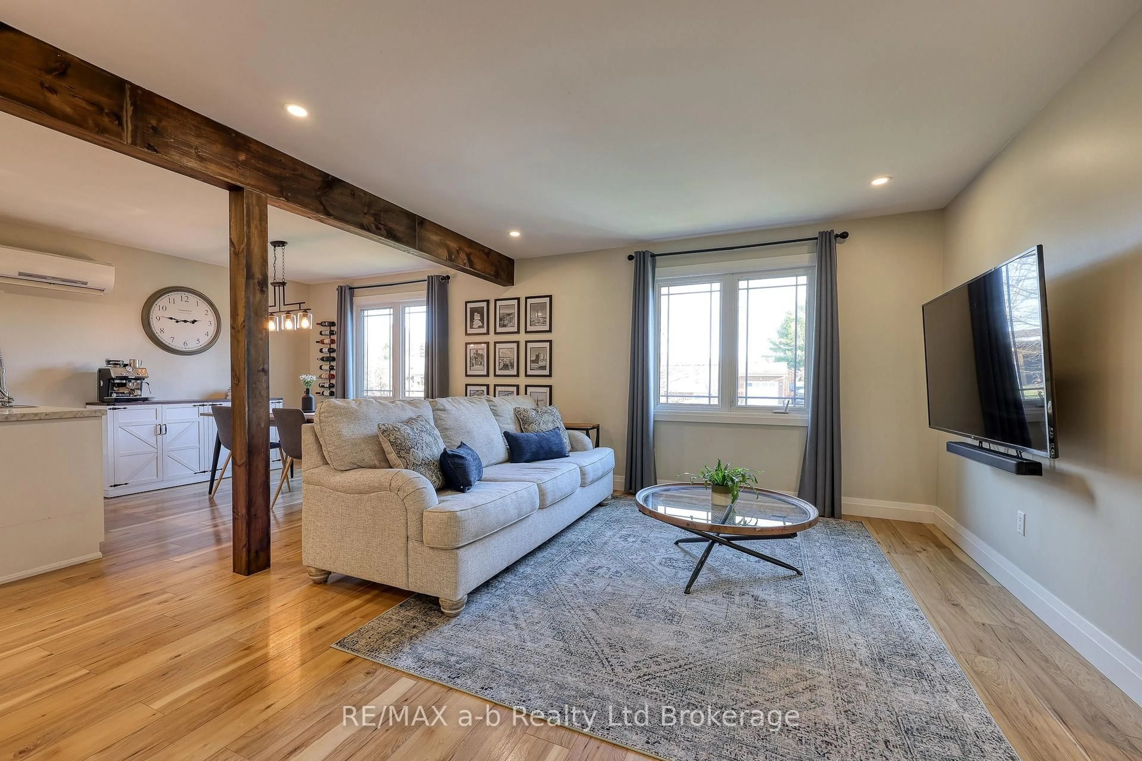 Living room with furniture, wood/laminate floor for 249 Arris Cres, West Perth Ontario N0K 1N0