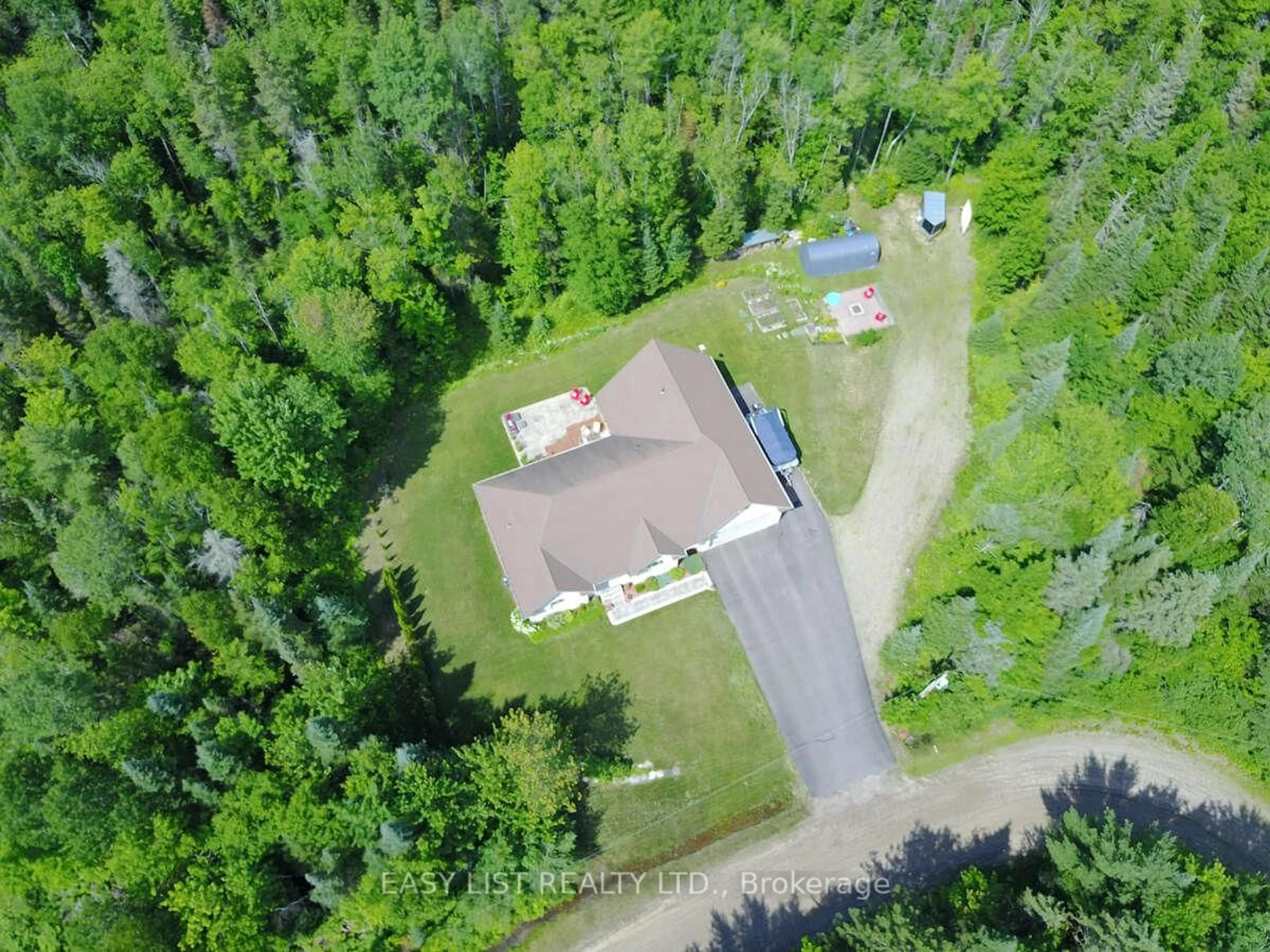 A pic from outside/outdoor area/front of a property/back of a property/a pic from drone, forest/trees view for 110 Monck Sq, Deep River Ontario K0J 1P0