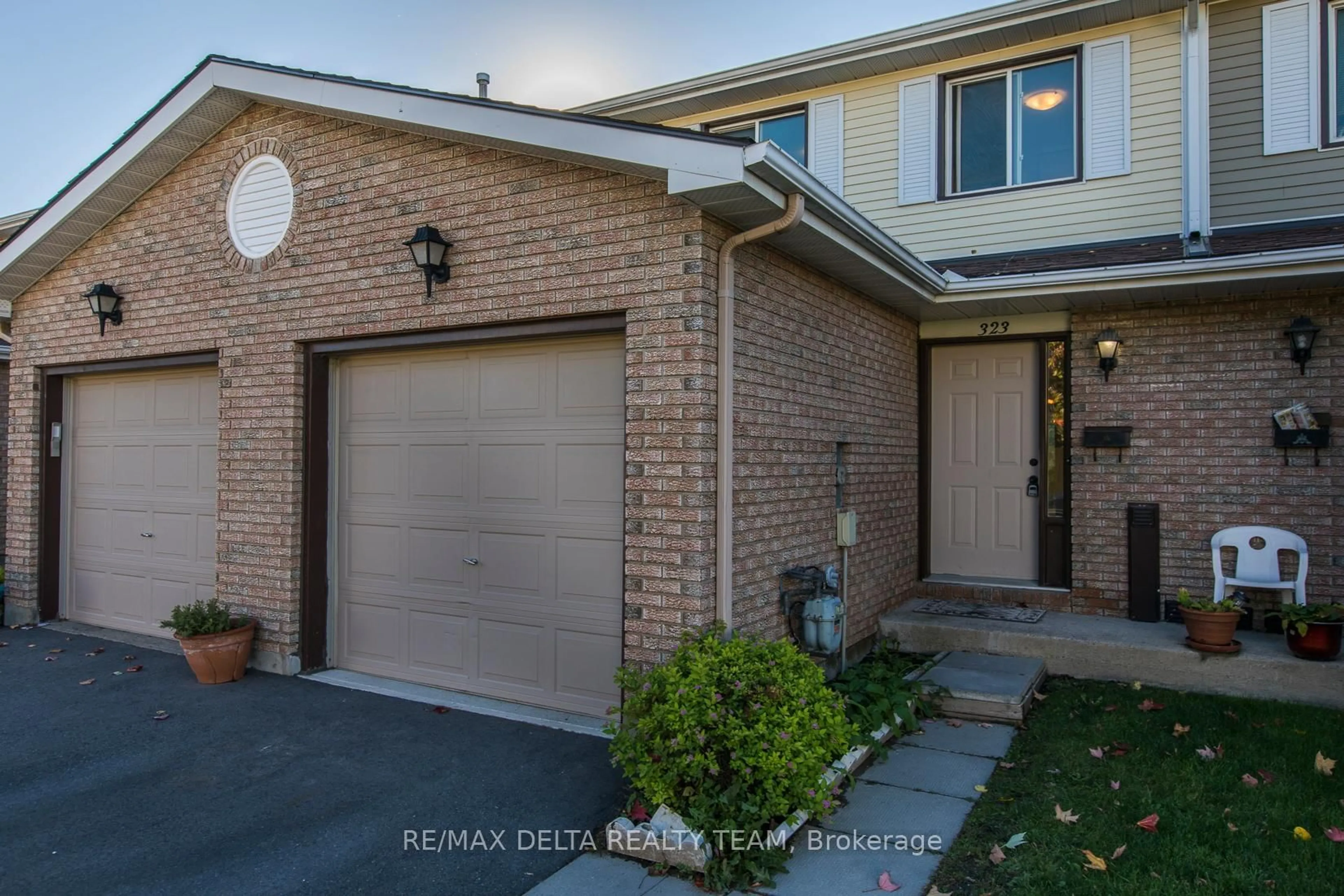 Home with brick exterior material, street for 323 Monica Cres #8, Ottawa Ontario K1E 3N6