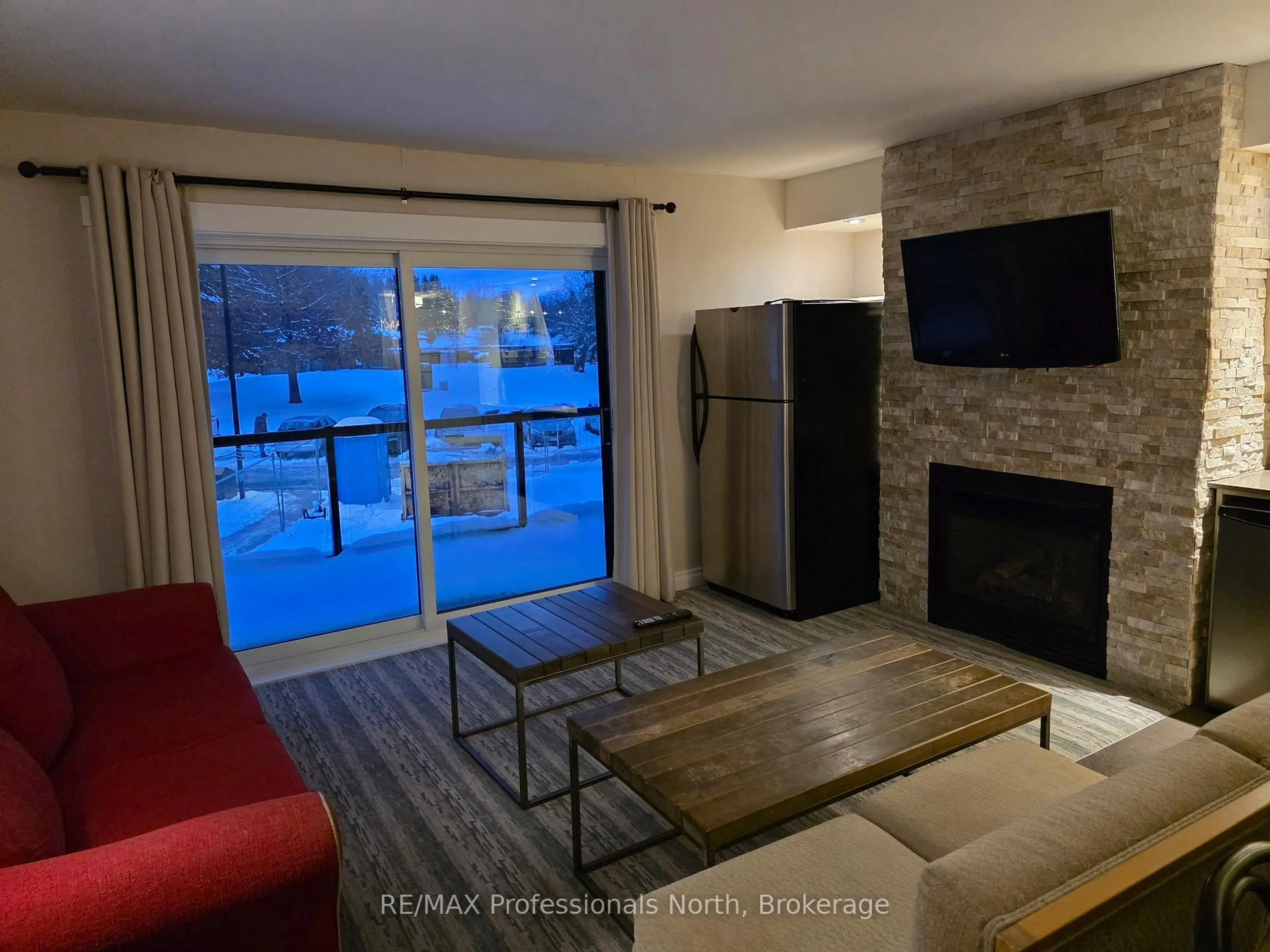 Living room with furniture, unknown for 1235 Deerhurst Dr #54-207, Huntsville Ontario P1H 2E8