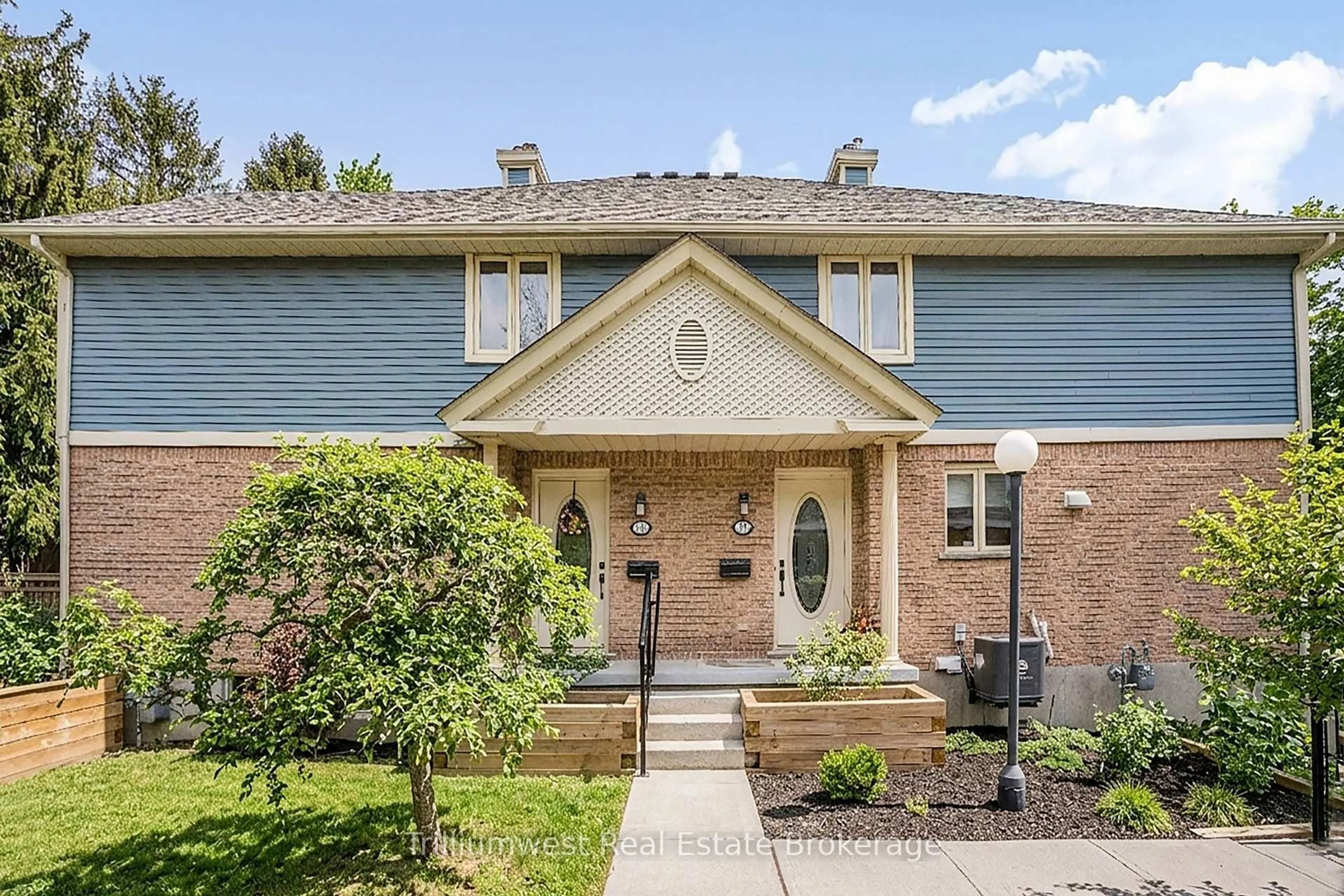 Home with brick exterior material, street for 941 Gordon St #11, Guelph Ontario N1G 4R9