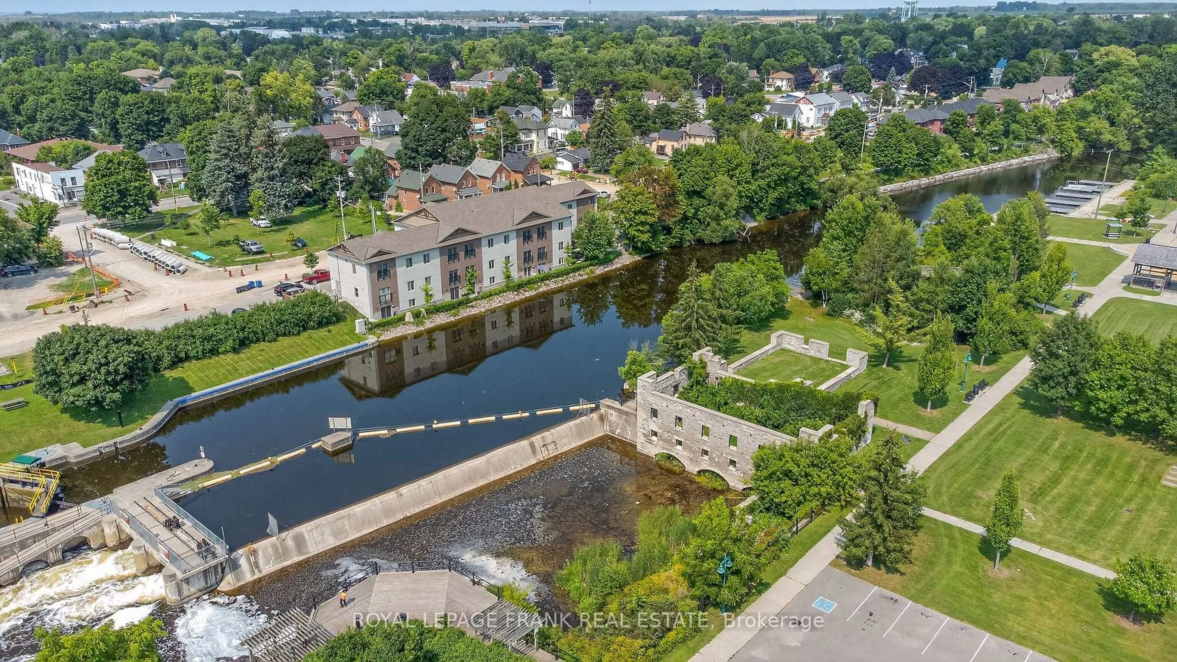 A pic from outside/outdoor area/front of a property/back of a property/a pic from drone, water/lake/river/ocean view for 25 King St #103, Kawartha Lakes Ontario K9V 1C7