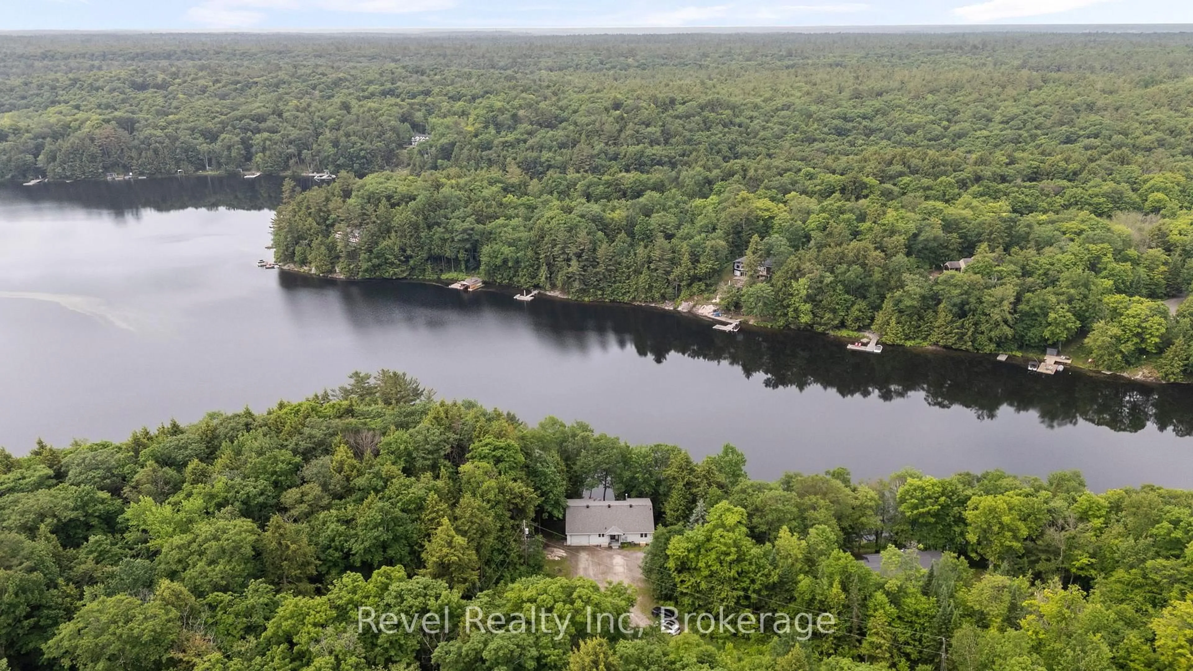 A pic from outside/outdoor area/front of a property/back of a property/a pic from drone, water/lake/river/ocean view for 30 Sparrow Rd, Seguin Ontario P0C 1J0