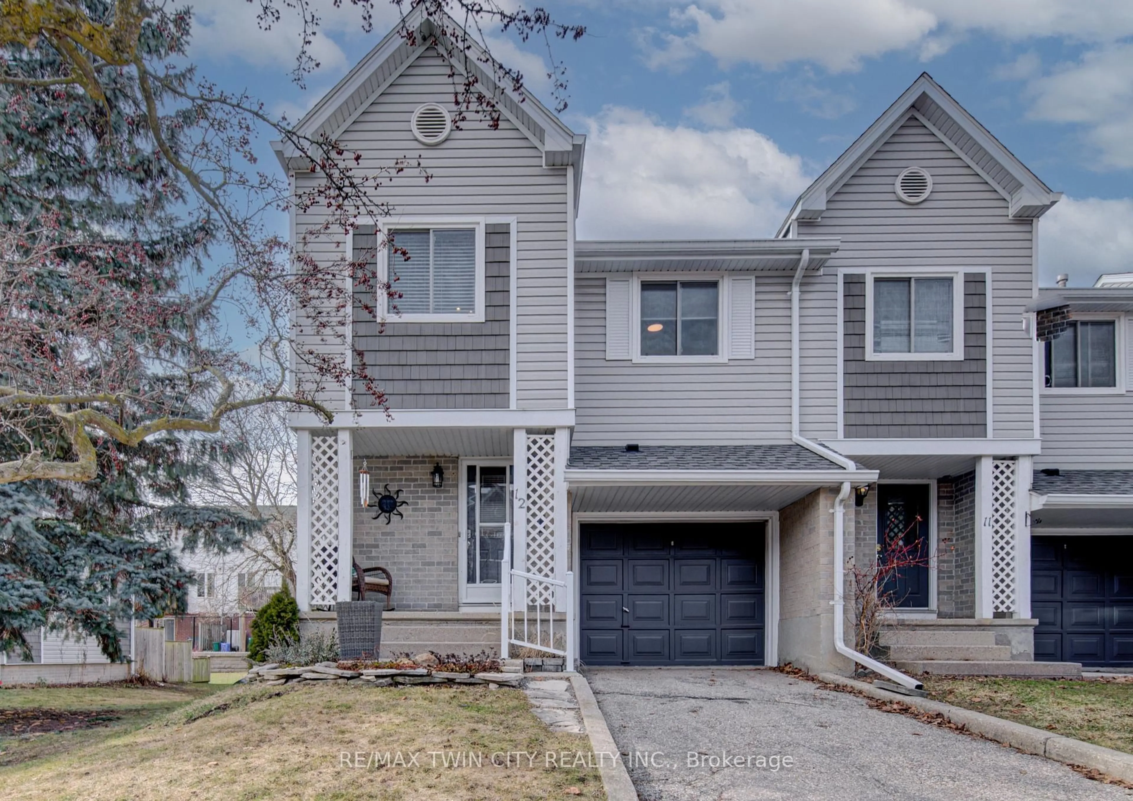 Home with vinyl exterior material, street for 54 Green Valley Dr #12, Kitchener Ontario N2P 1Z9