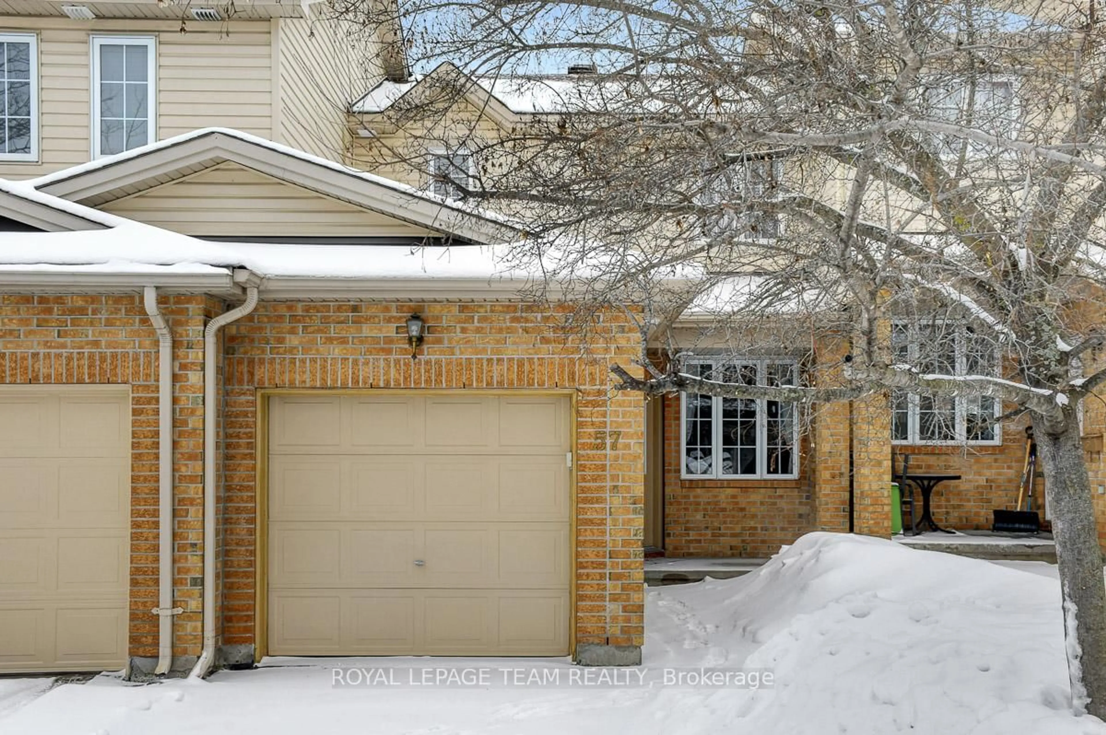 Home with brick exterior material, street for 57 Cargrove Private, Ottawa Ontario K1K 4Y7