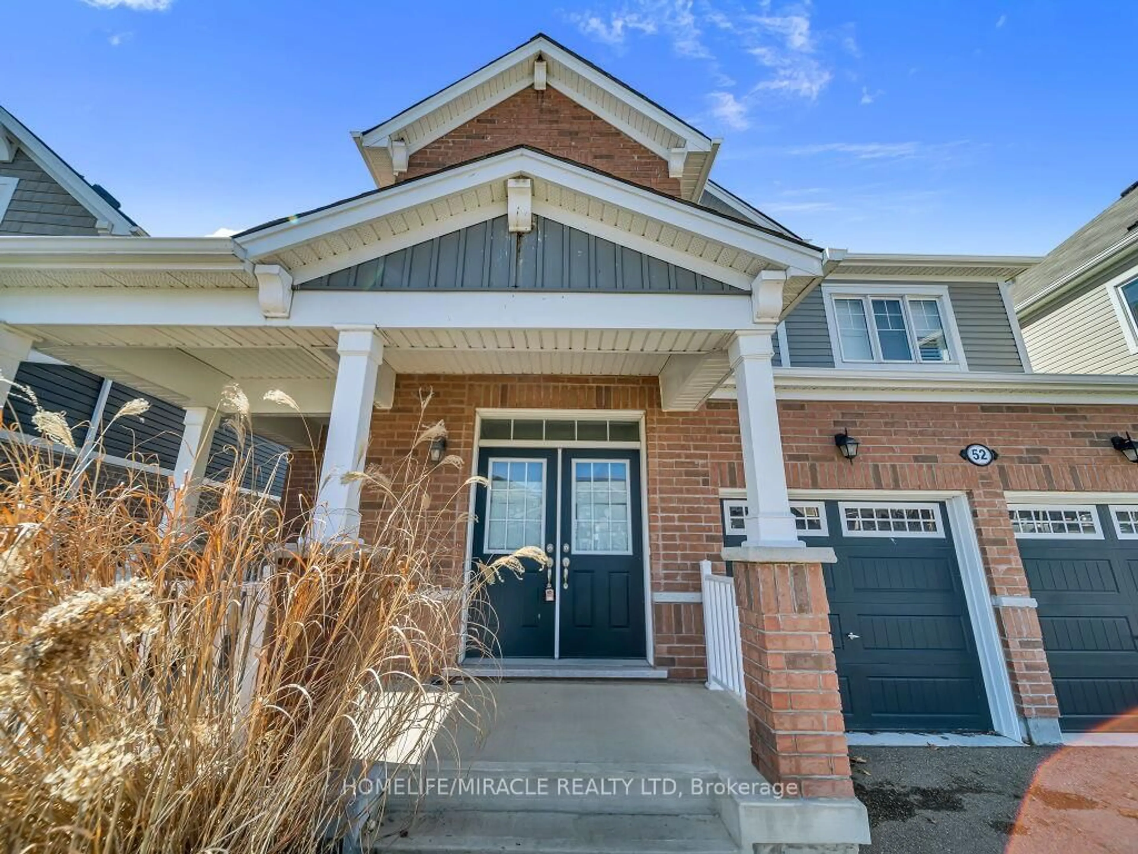 Home with brick exterior material, street for 52 Compass Tr, Cambridge Ontario N3E 0B7