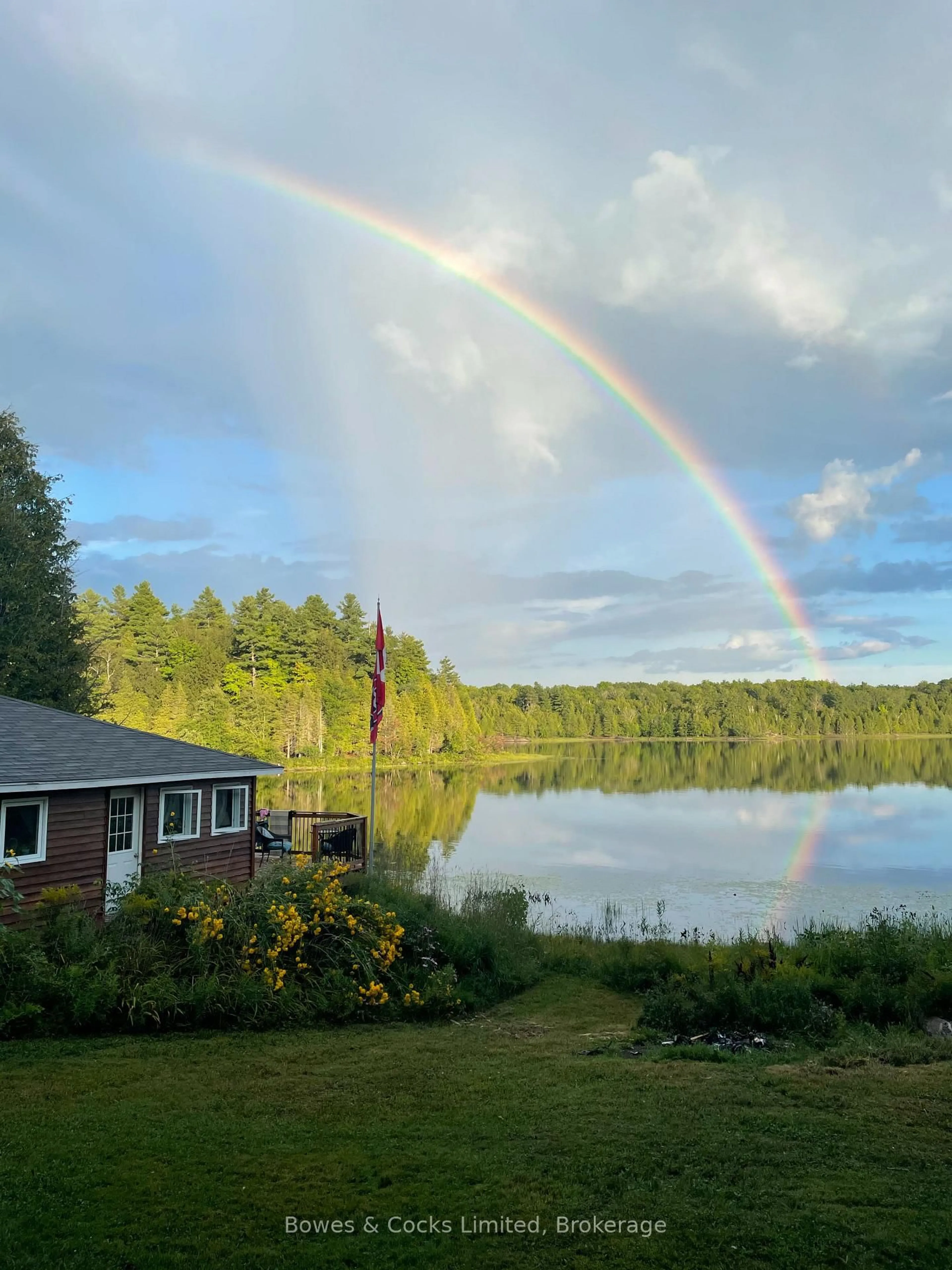 A pic from outside/outdoor area/front of a property/back of a property/a pic from drone, water/lake/river/ocean view for 1022 Hummingbird Lane, Arden Ontario K0H 1B0