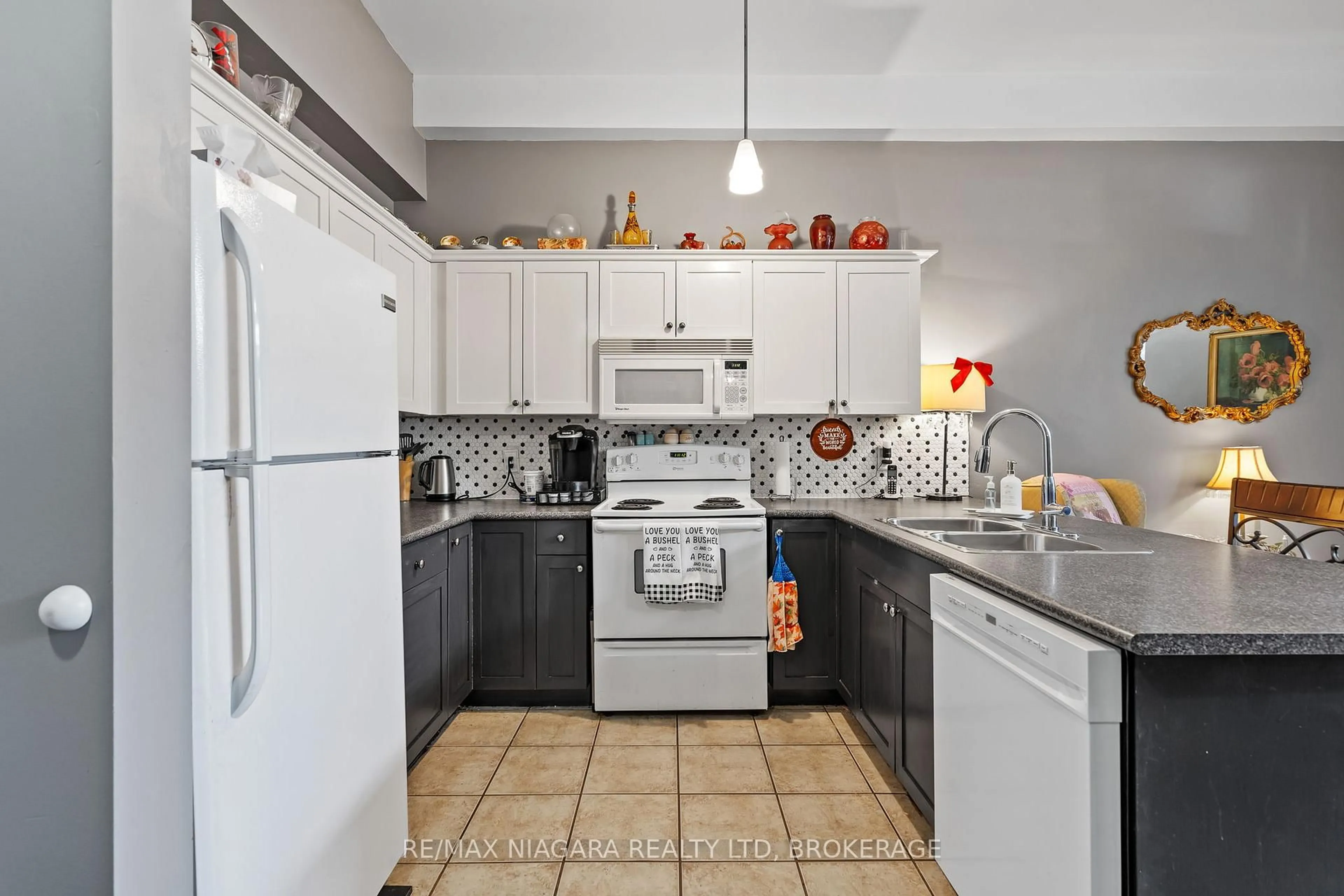 Standard kitchen, ceramic/tile floor for 6365 Drummond Rd #103, Niagara Falls Ontario L2G 4N1