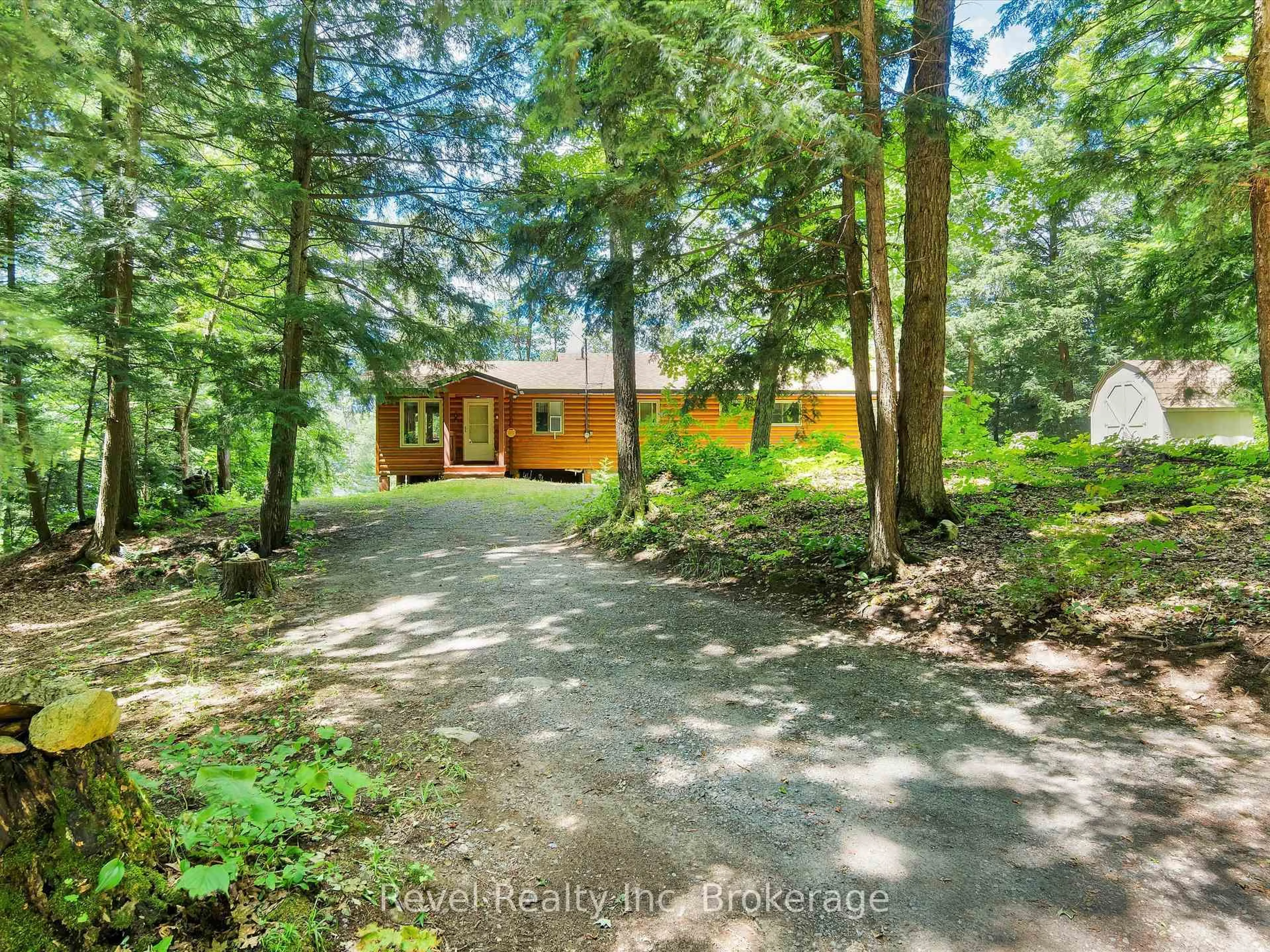 A pic from outside/outdoor area/front of a property/back of a property/a pic from drone, forest/trees view for 1022 Bird Lake Cres, Bracebridge Ontario P1L 1X1