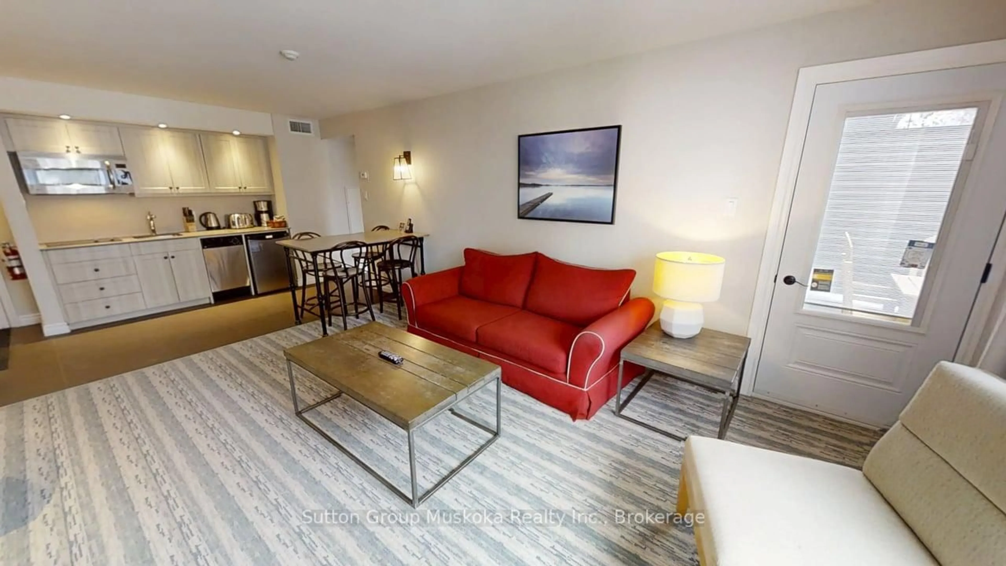 Living room with furniture, wood/laminate floor for 1235 Deerhurst Dr #52-305, Huntsville Ontario P1H 2E8