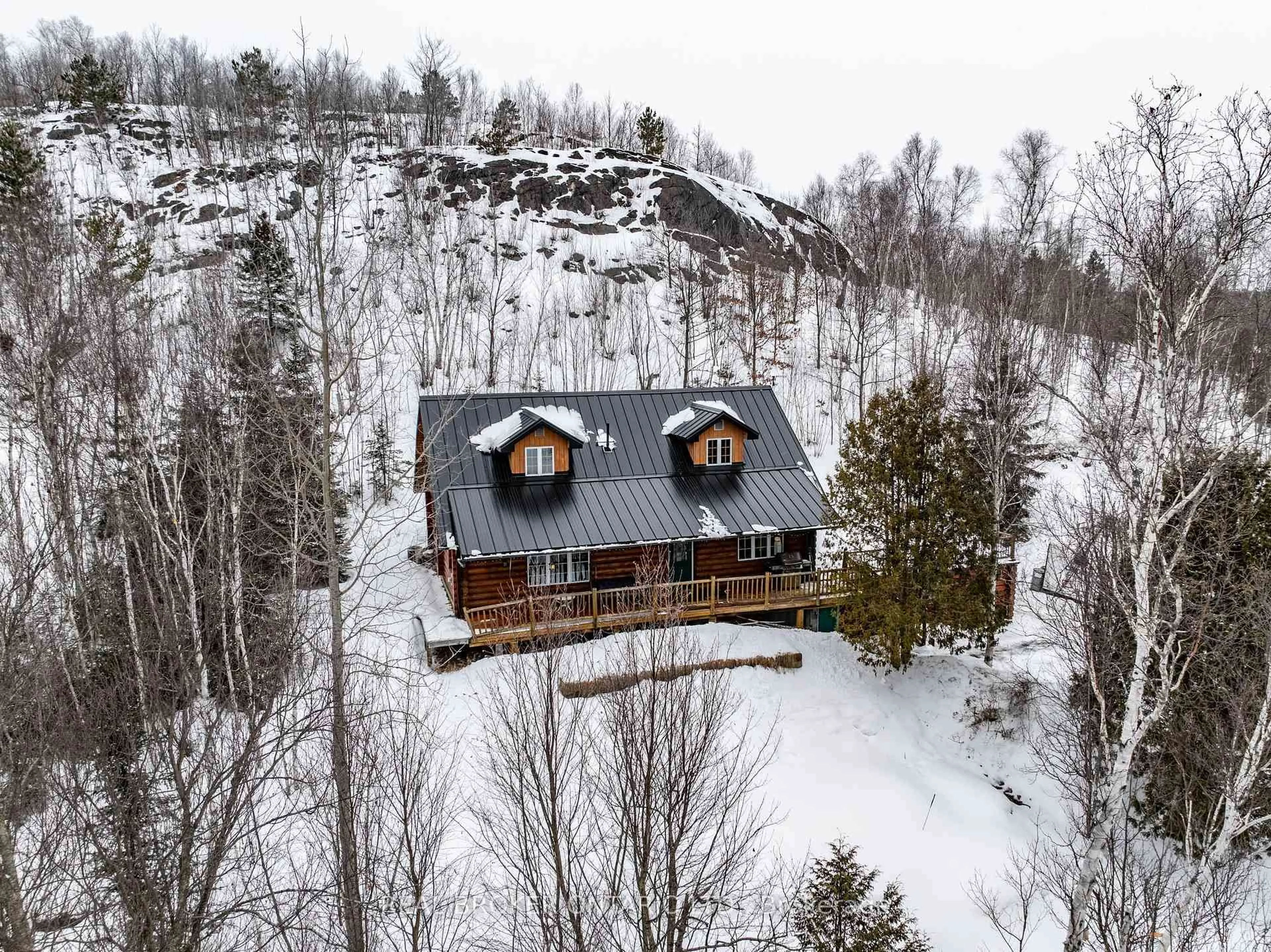 A pic from outside/outdoor area/front of a property/back of a property/a pic from drone, mountain view for 5087 Tilton Lake Rte, Greater Sudbury Ontario P3G 1K9