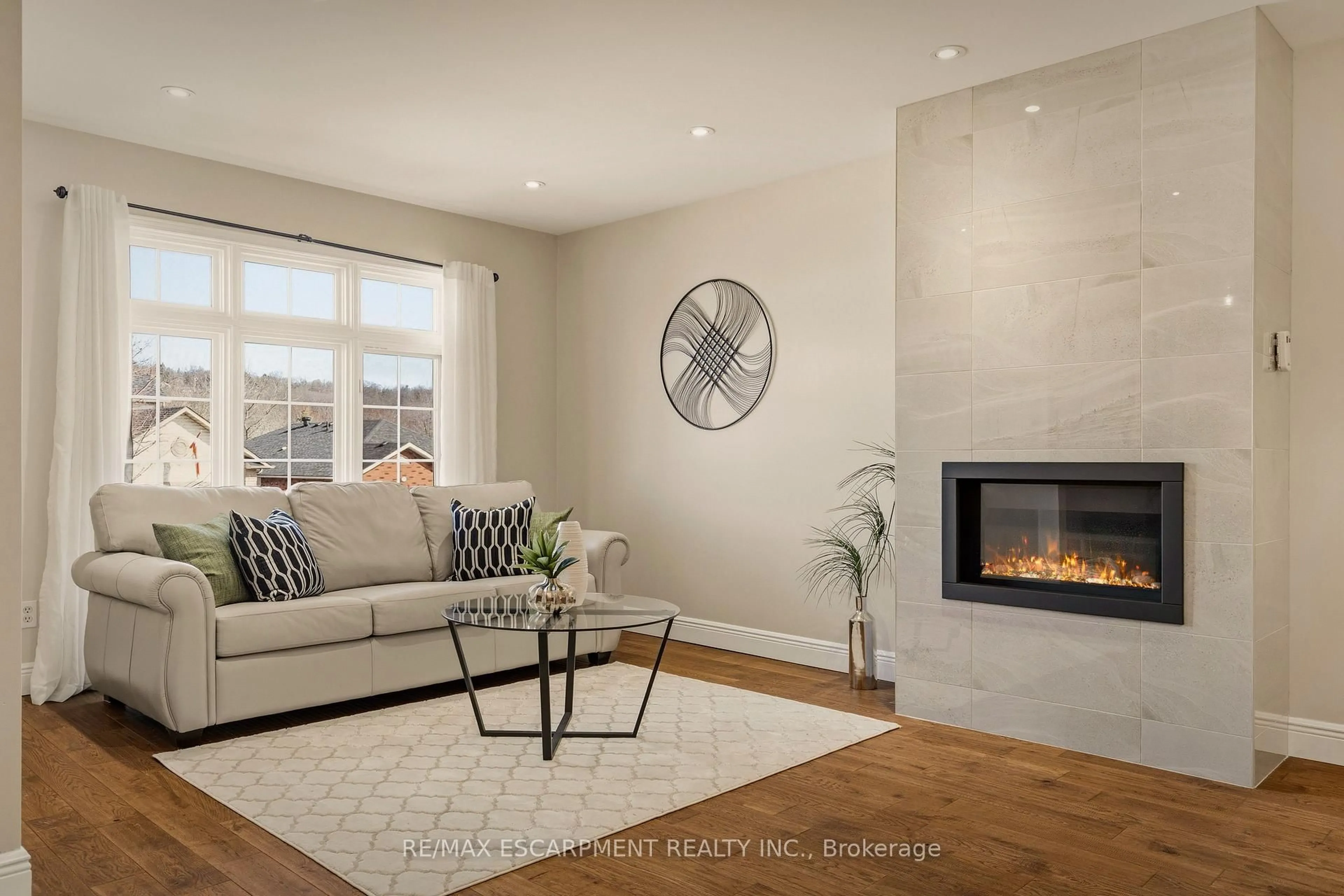 Living room with furniture, ceramic/tile floor for 25 Linington Tr, Hamilton Ontario L9H 7A3