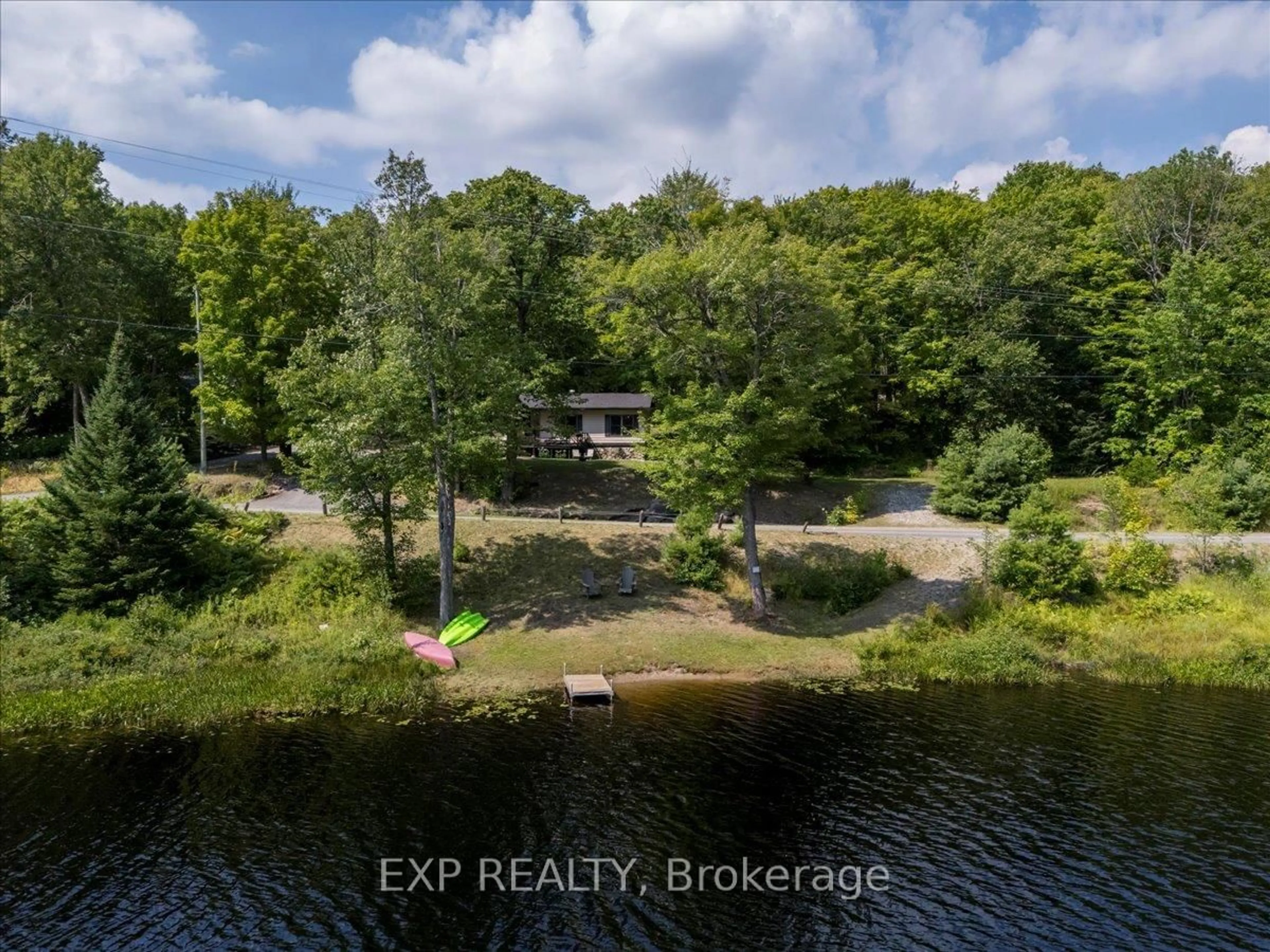 A pic from outside/outdoor area/front of a property/back of a property/a pic from drone, water/lake/river/ocean view for 1867 Fraserburg Rd, Bracebridge Ontario P1L 1X3
