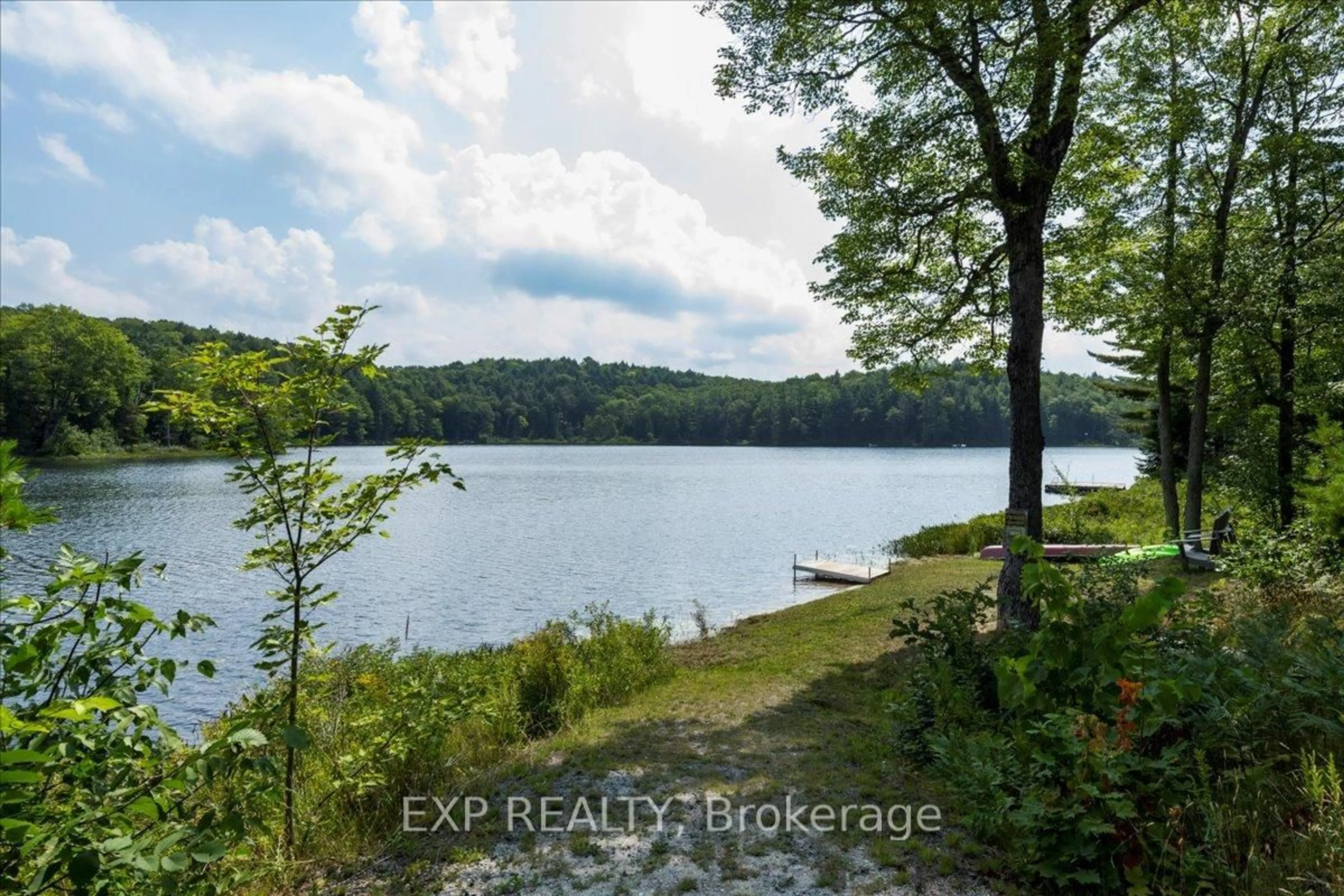 A pic from outside/outdoor area/front of a property/back of a property/a pic from drone, water/lake/river/ocean view for 1867 Fraserburg Rd, Bracebridge Ontario P1L 1X3