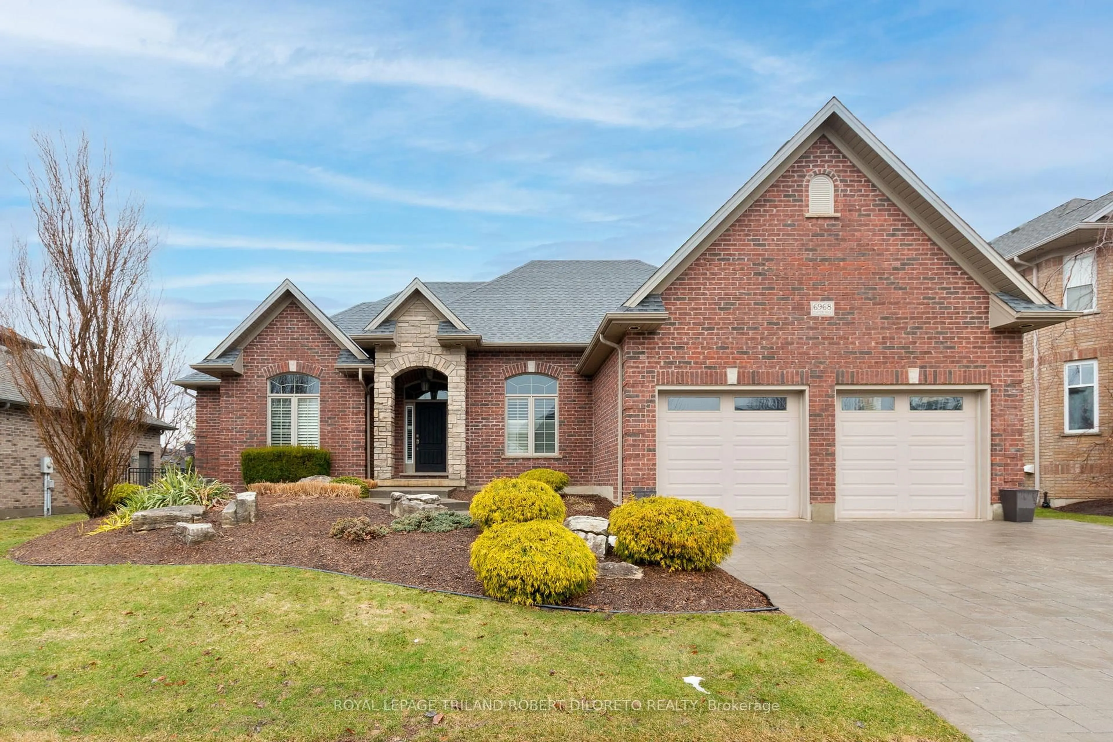 Home with brick exterior material, street for 6968 Clayton Walk, London South Ontario N6P 0B2